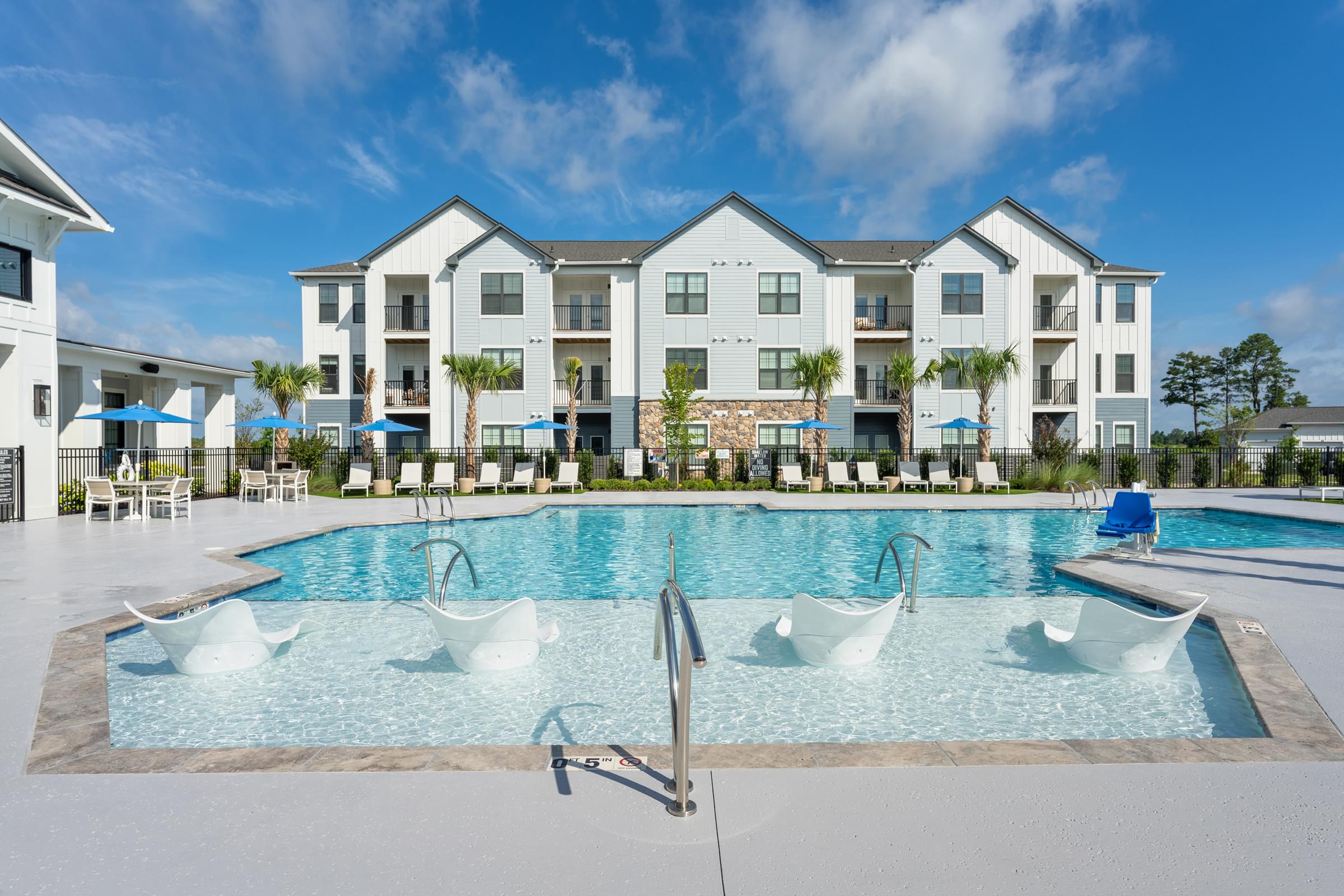 Resort-Style Saltwater Pool and Pool House with Seating and Fireplace
