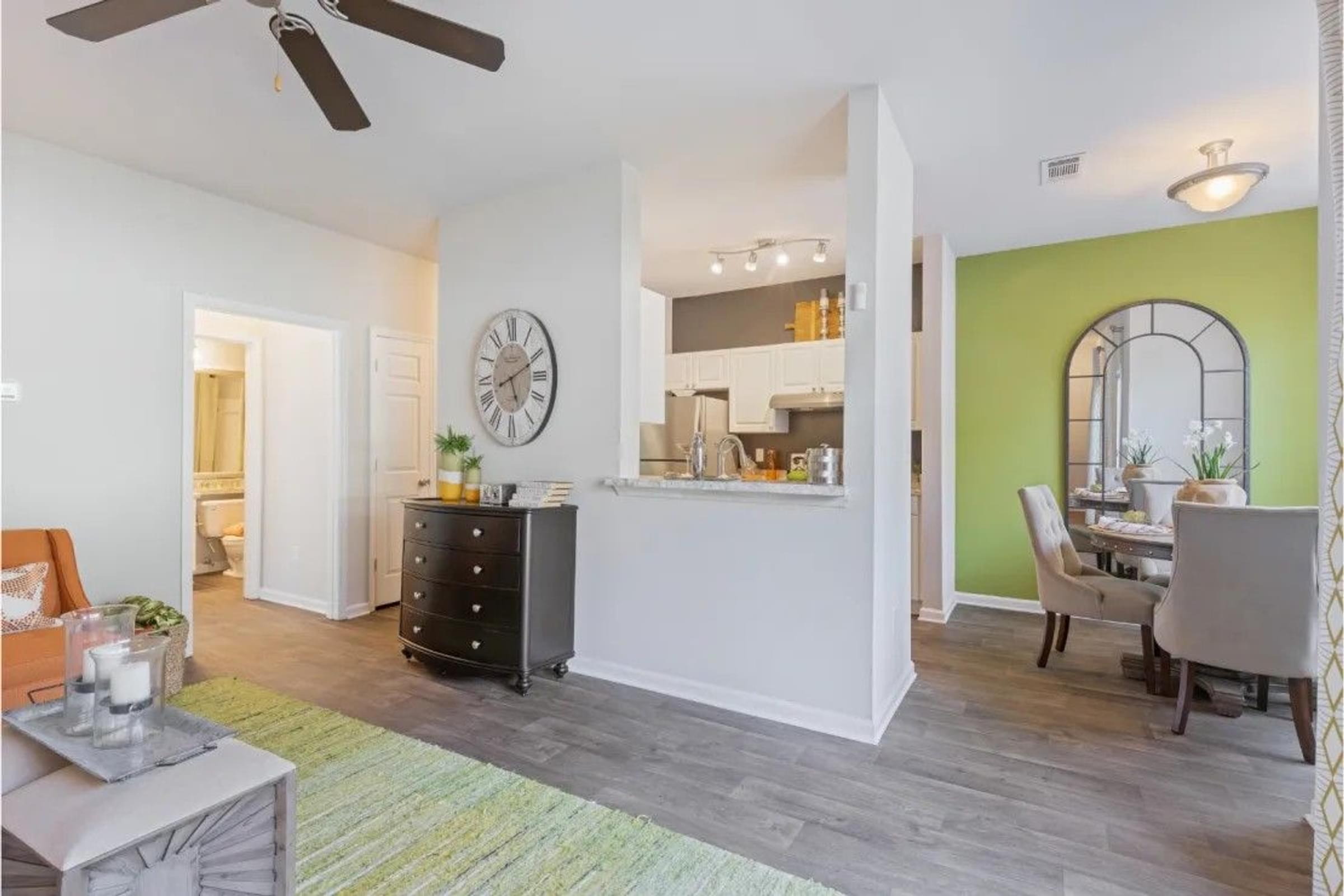 Living Room View with a Dining Area in the Background.