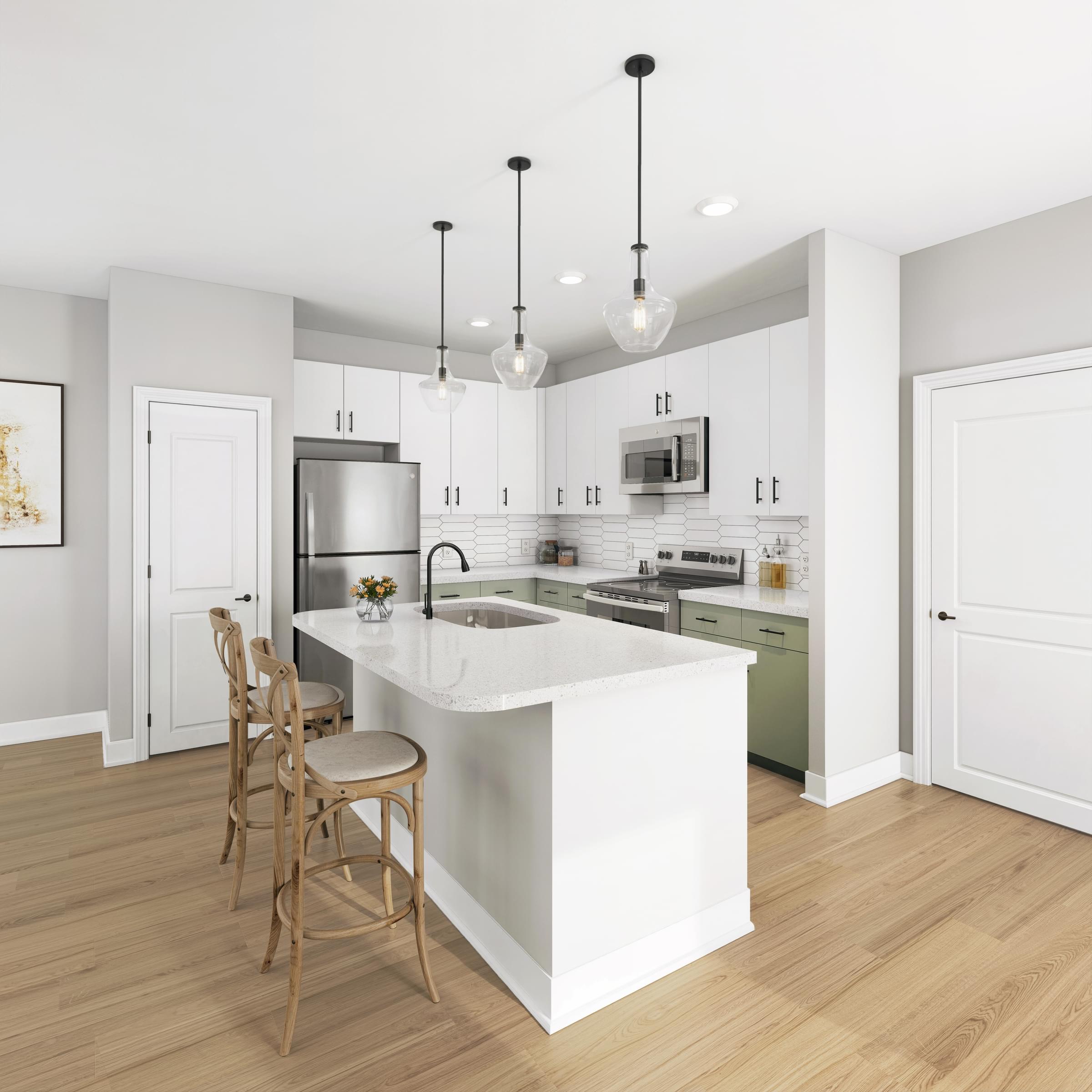 A kitchen with a white island and wooden floors.