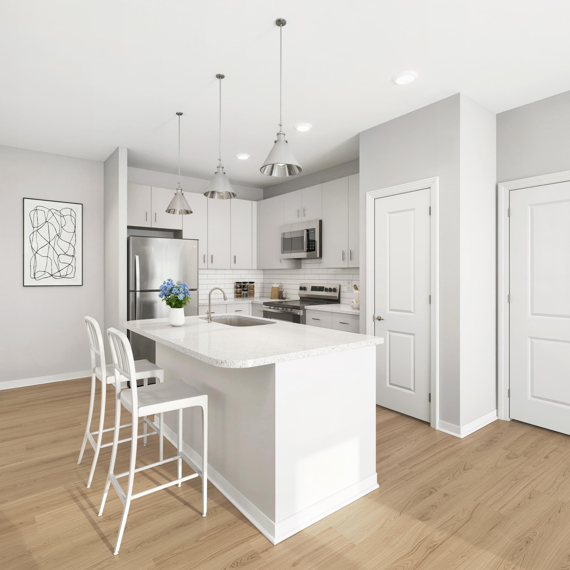A modern kitchen with a white island and bar stools.
