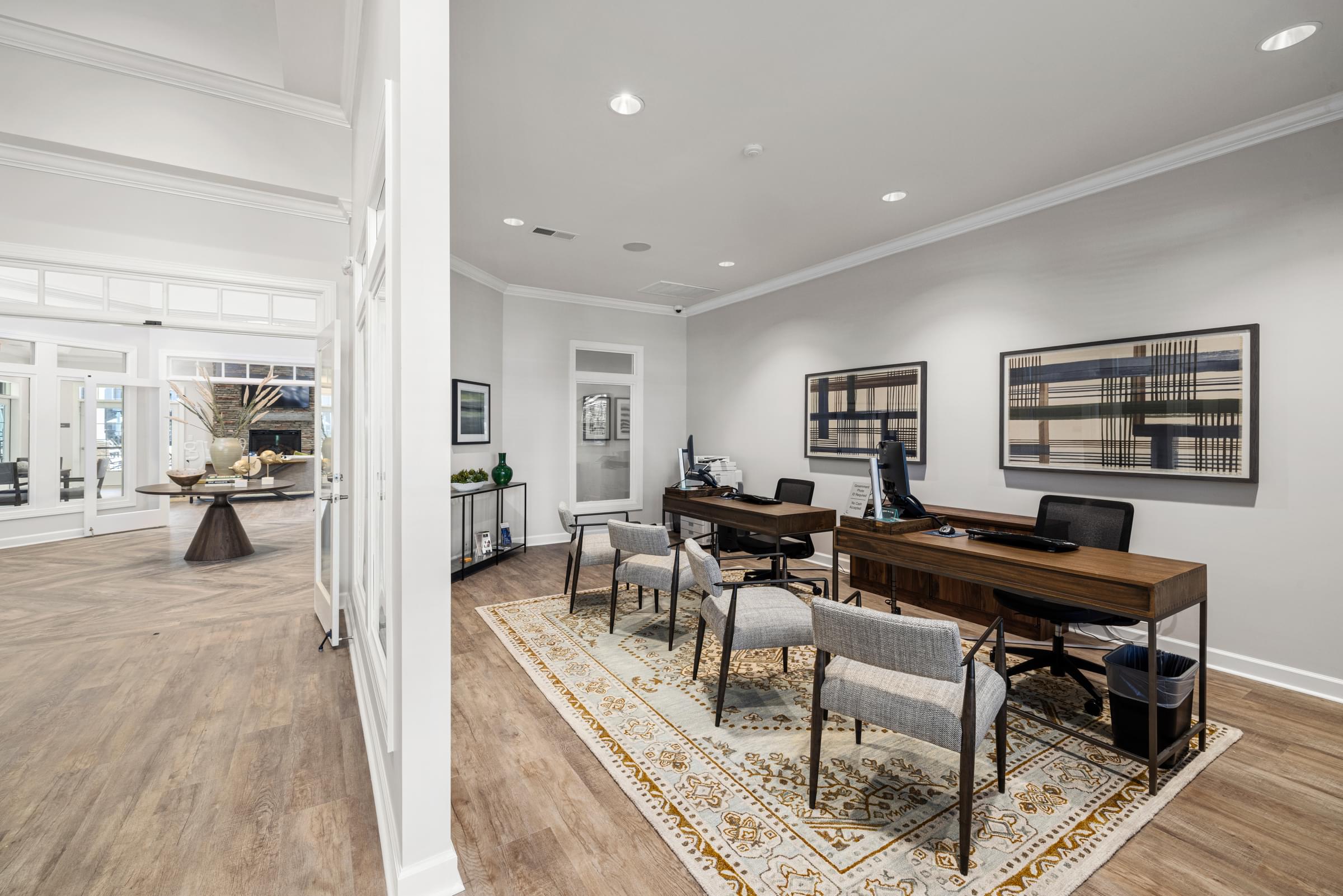 Clubhouse Business Center Area with Chairs , Desks and Computers.