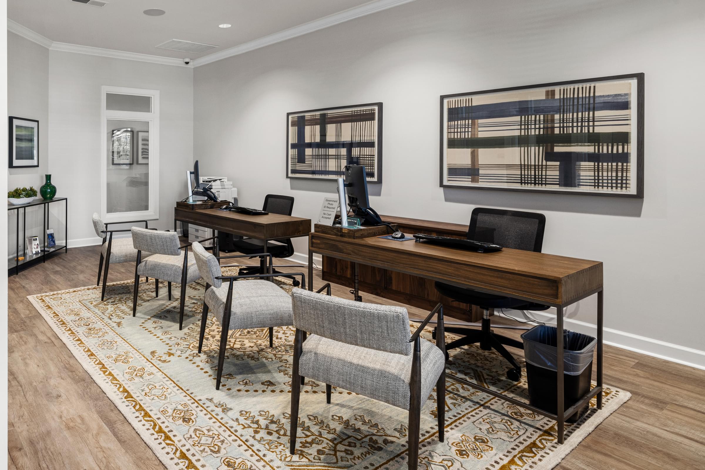 A Room with Two Desks and Chairs Next to Each Other.