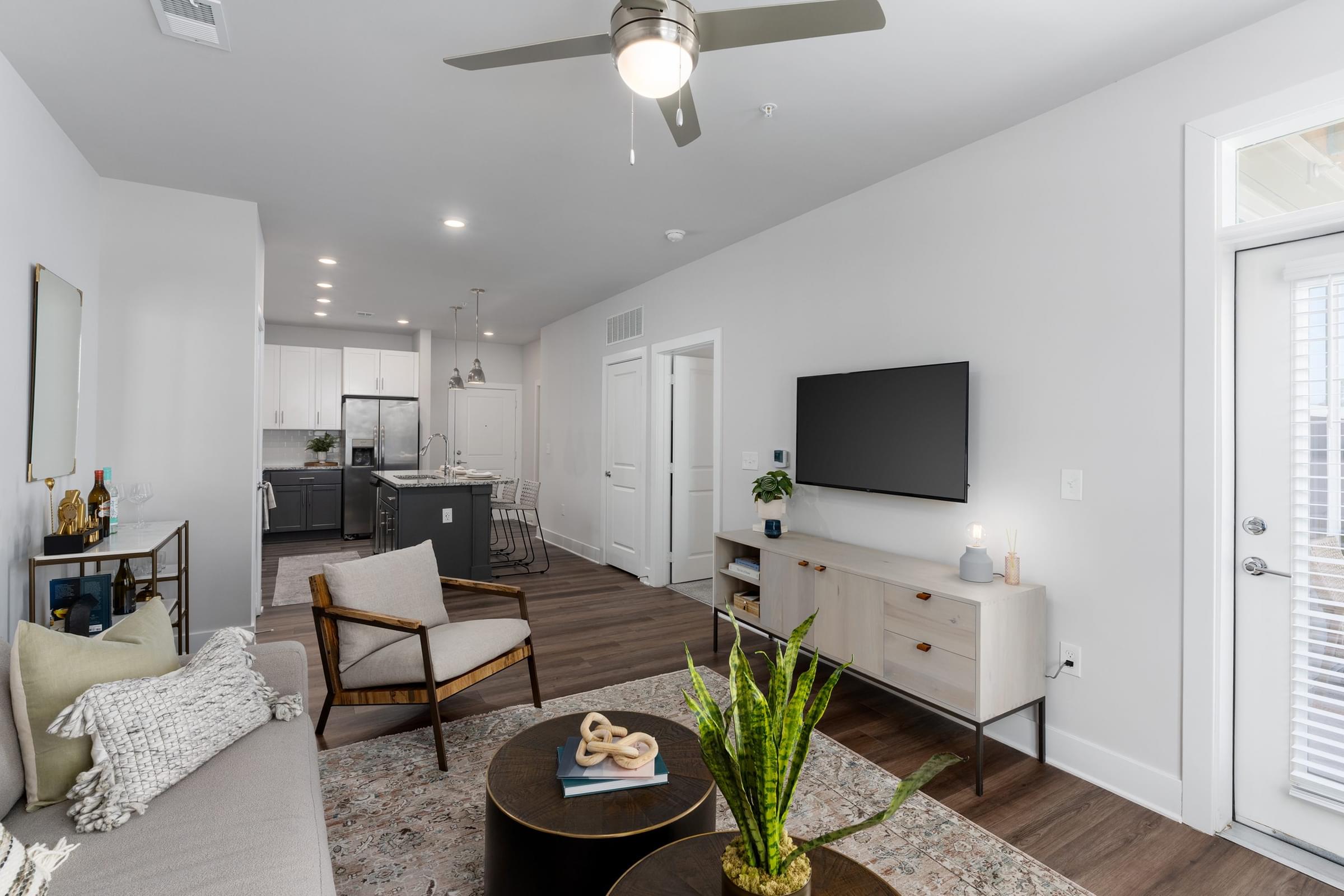 Open-Concept Floor Plans with Plank-Style Flooring, and High Living Room Ceiling