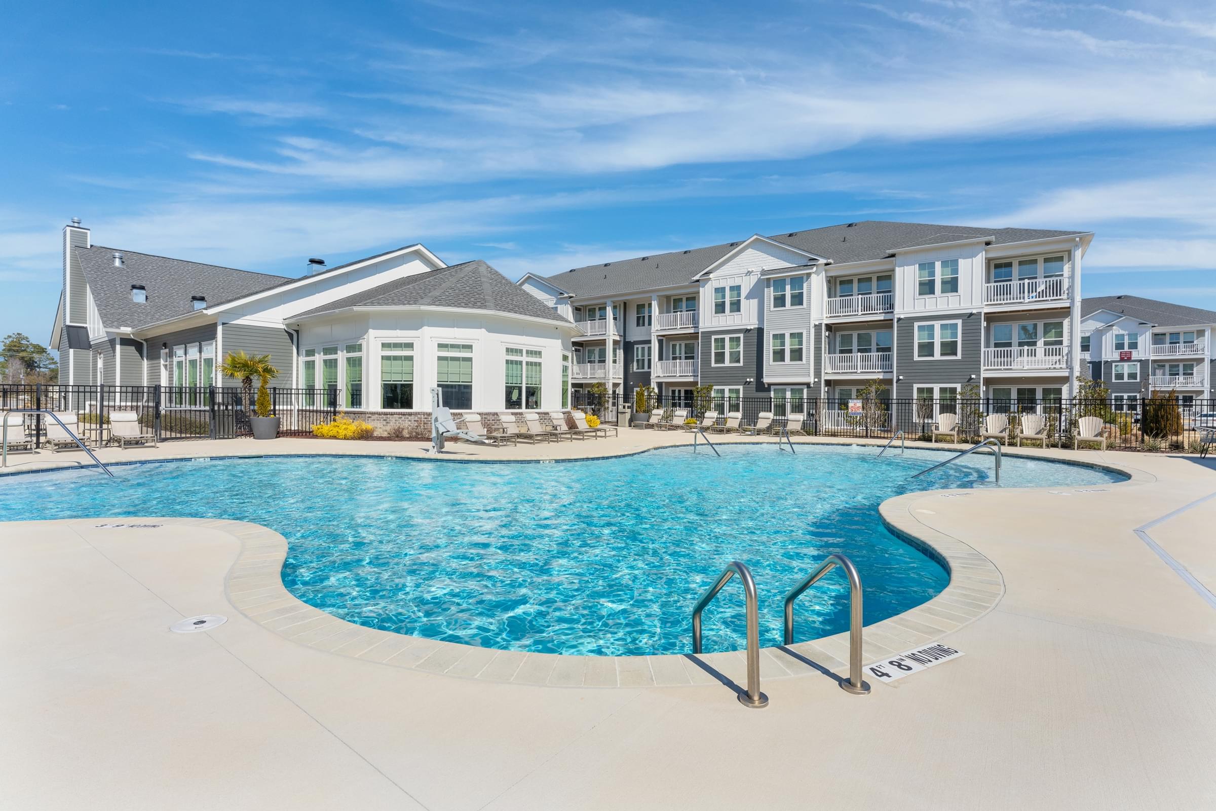 Resort-Style Pool with Sun Shelf and Inset Seating