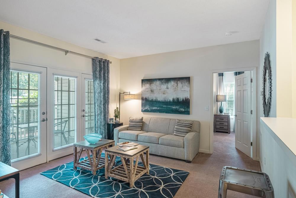 a living room with a couch and a table