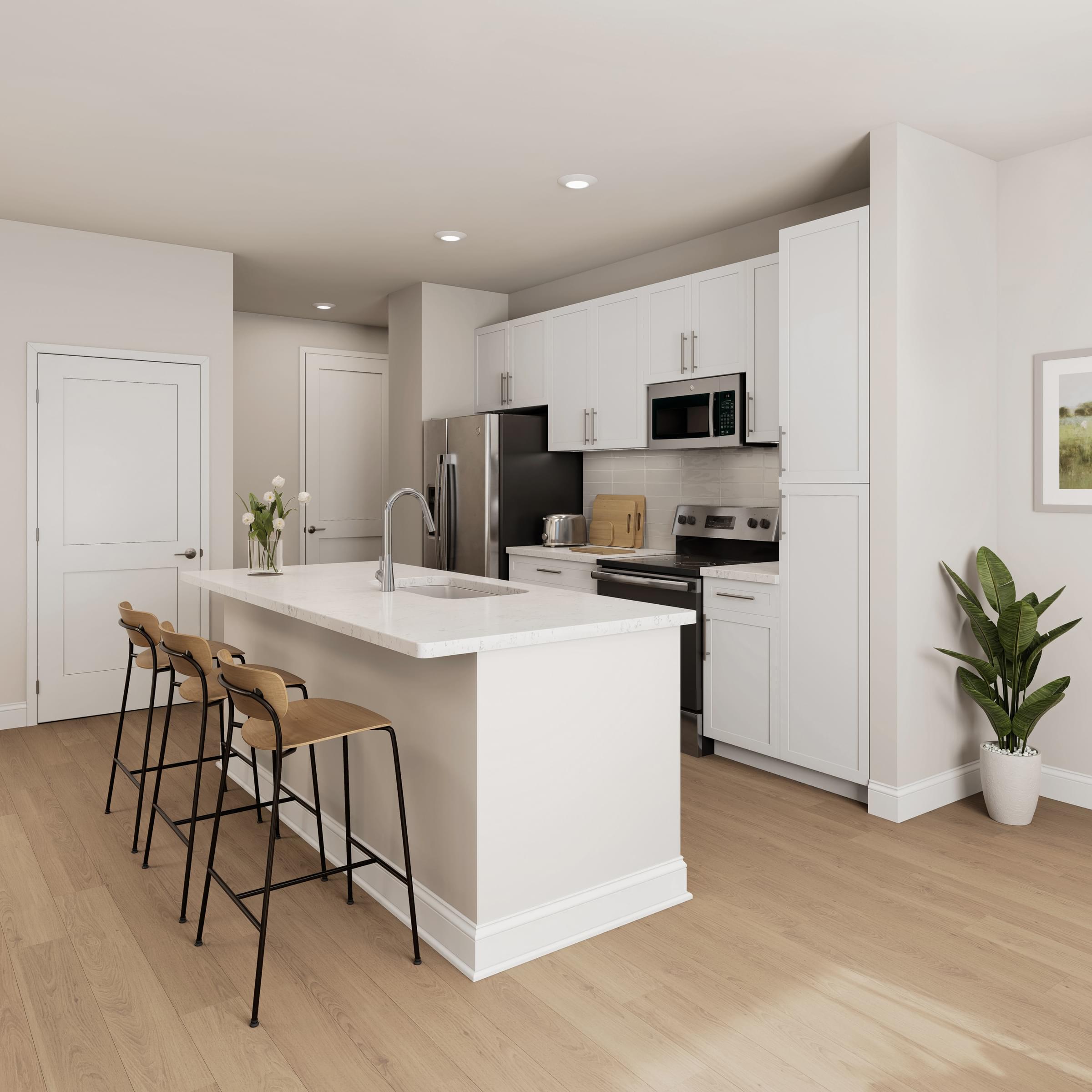 A modern kitchen with a white island and bar stools.