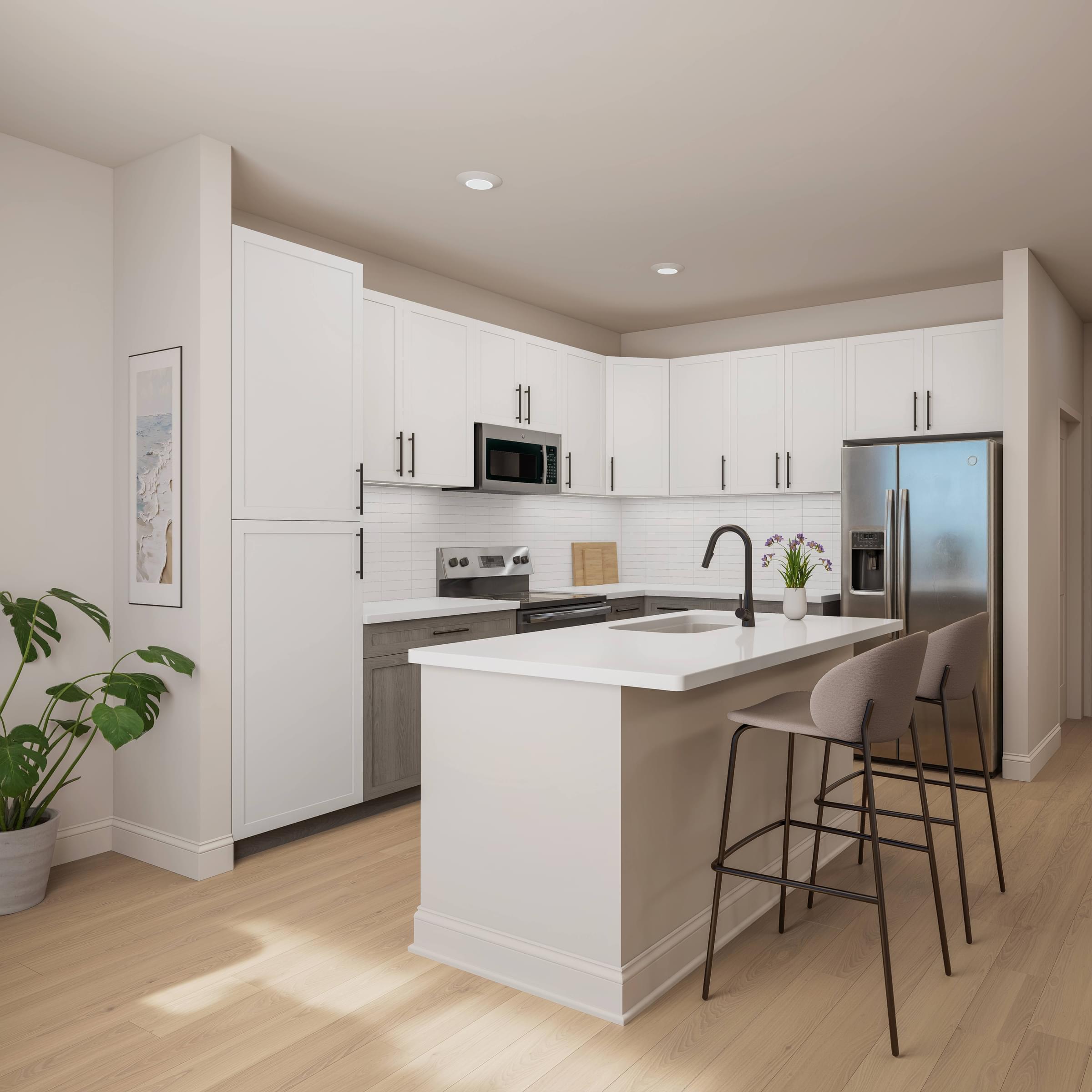 A modern kitchen with white cabinets and a large island.