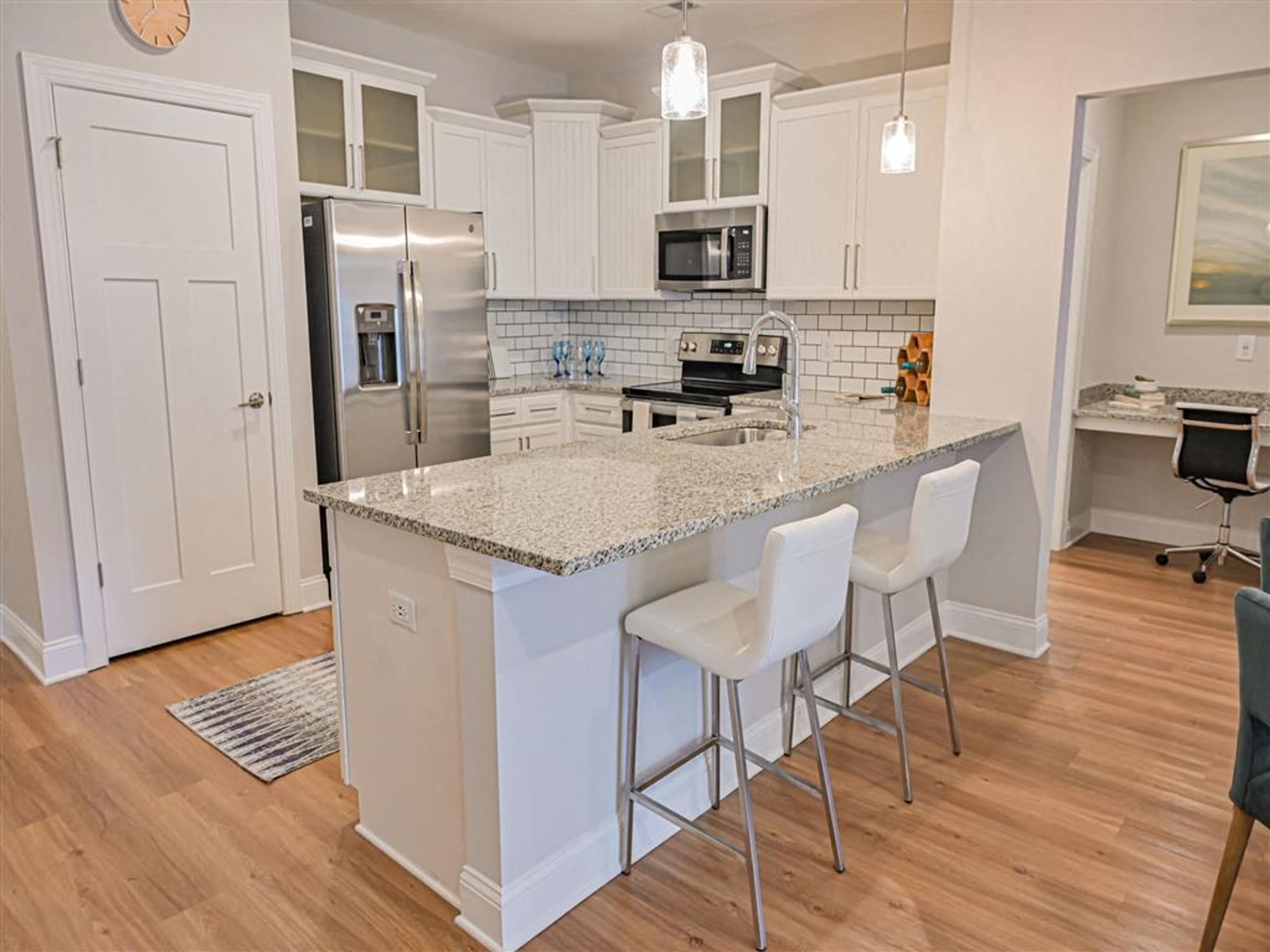 a kitchen with a counter top and a refrigerator