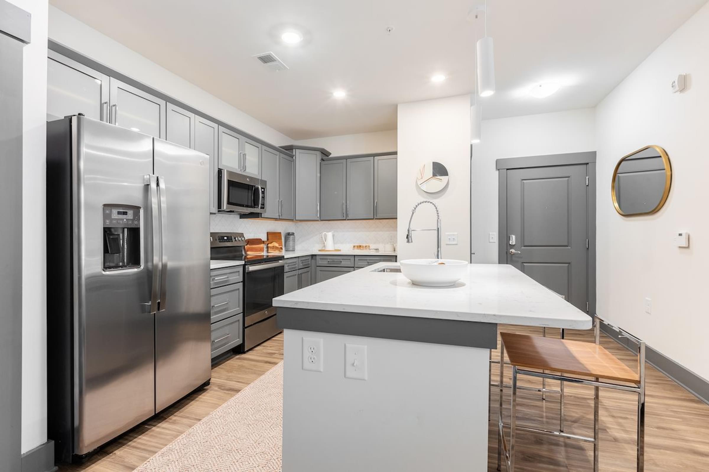 a kitchen with stainless steel appliances and a counter top