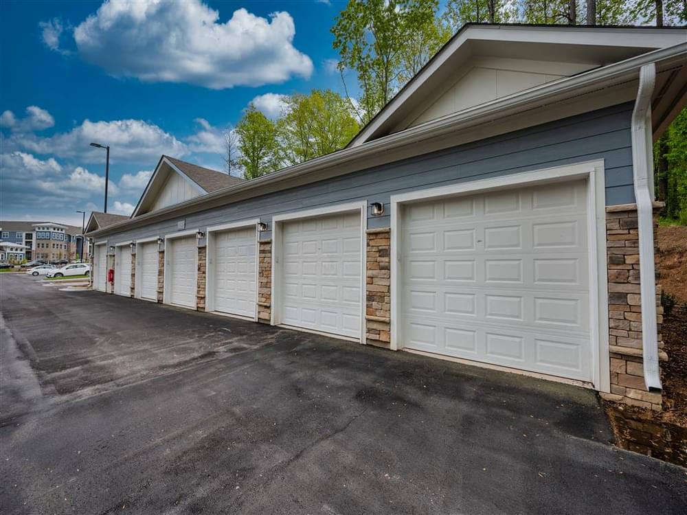 a white garage door on the side of a house