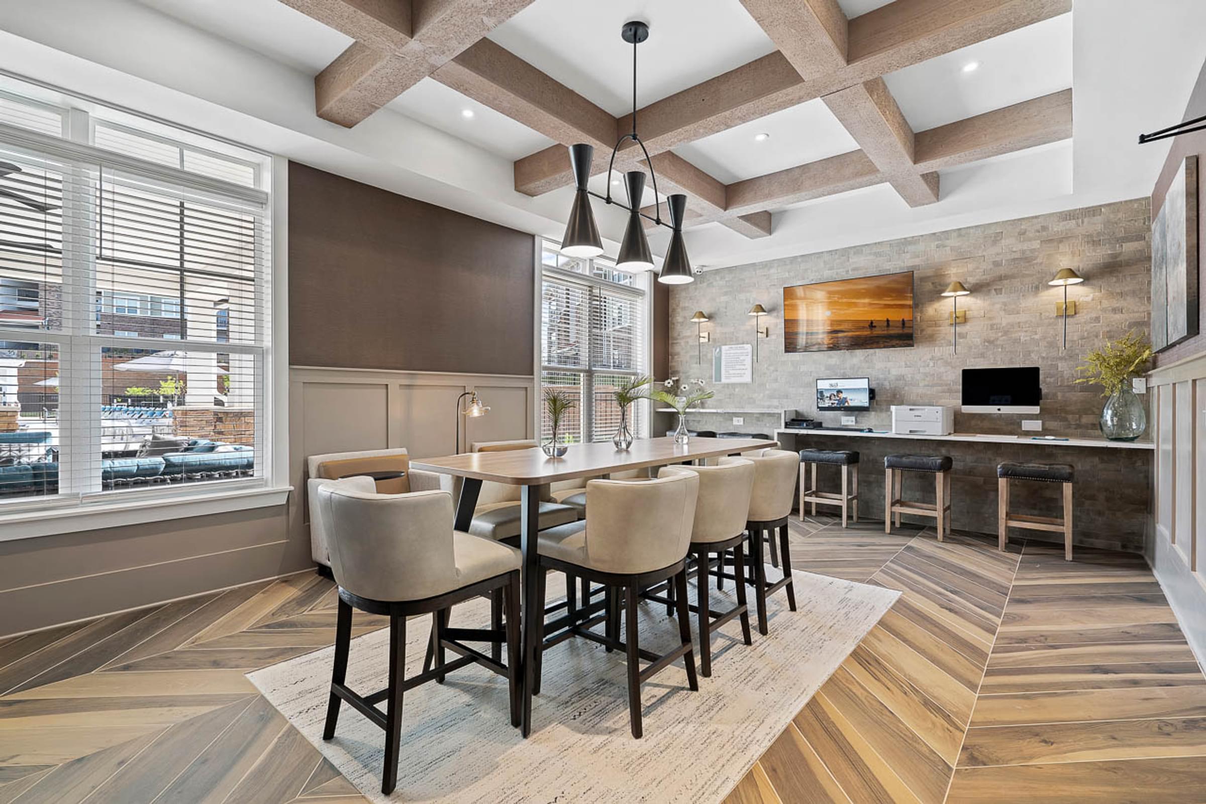 a dining room with a table and chairs