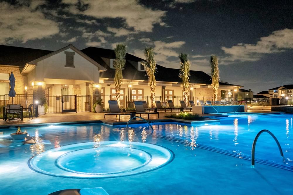 the swimming pool at night at the villas at night