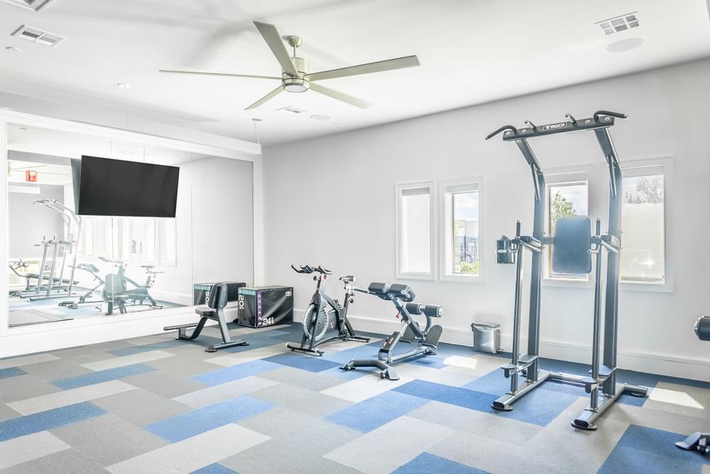 the gym at the district flats apartments in lenexa