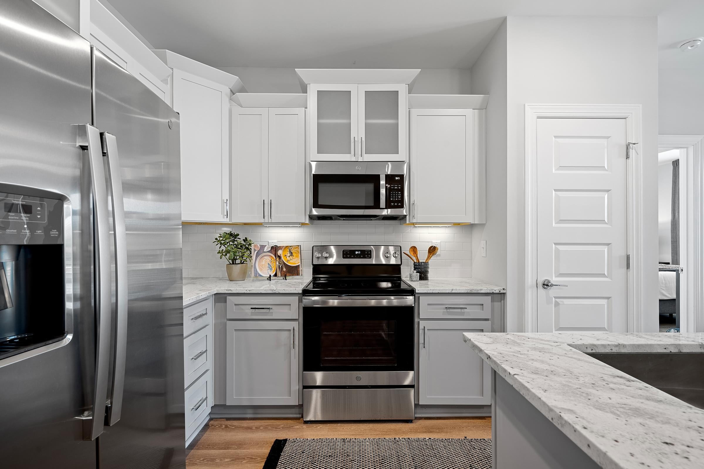 White Kitchen Cabinets with Breakfast Bar Island