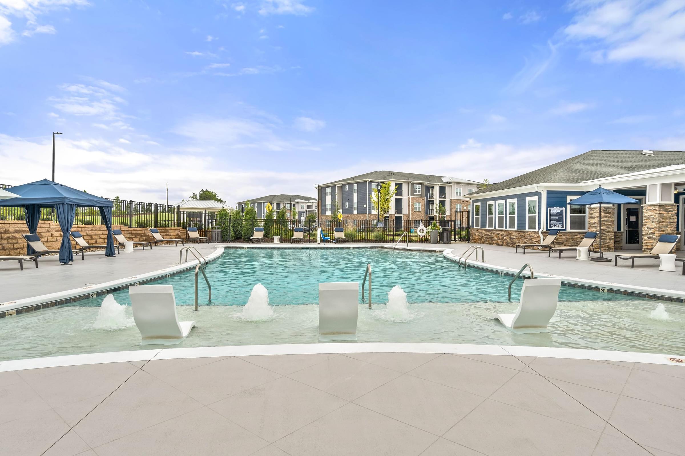 Resort-Style Swimming Pool with Sun Shelf and Expansive Sun Deck
