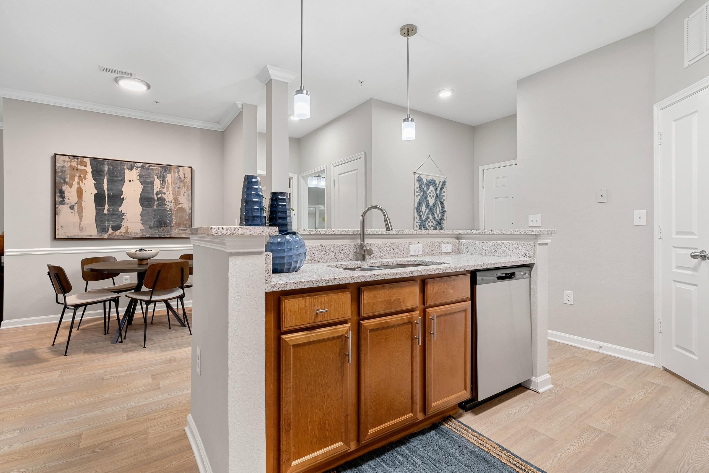 an open kitchen and dining area with a table and chairs