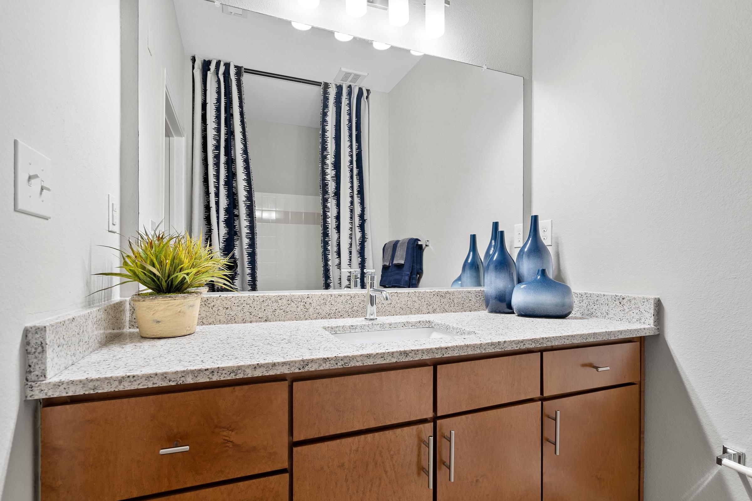 Bathroom with Large Vanity and White Counterops