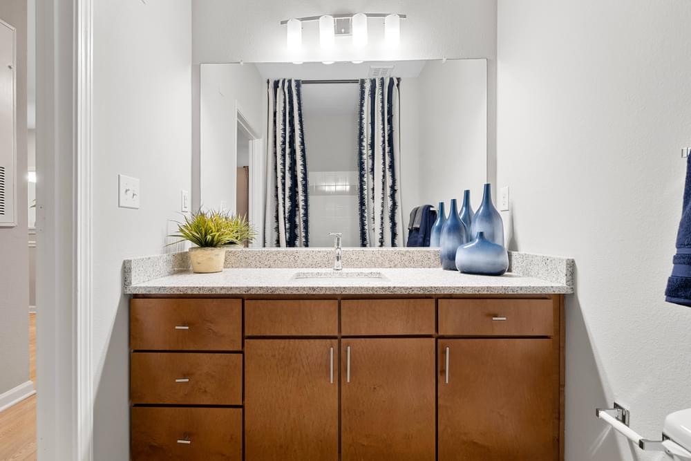 our apartments offer a bathroom with a sink and a mirror