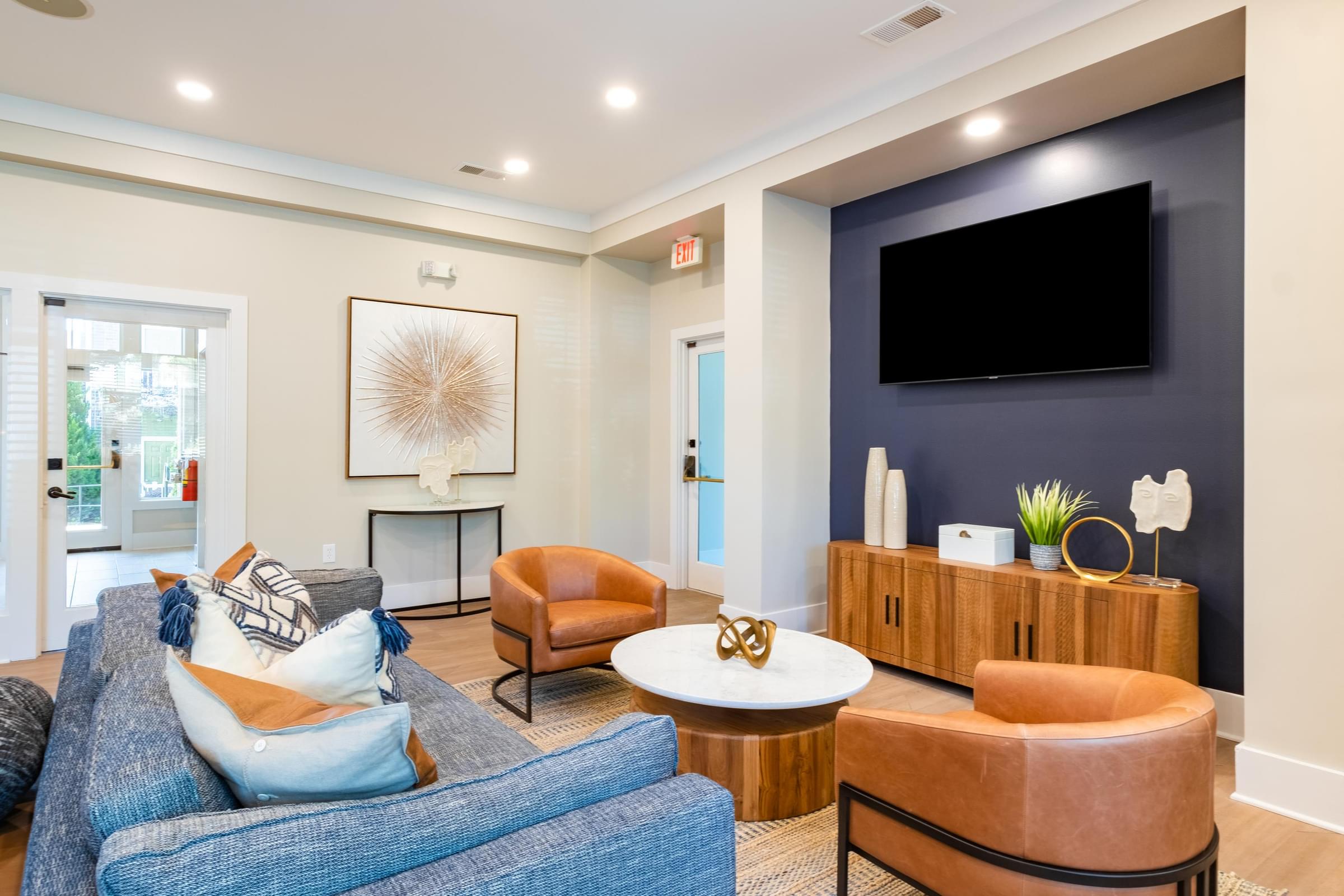 a living room with couches and a tv