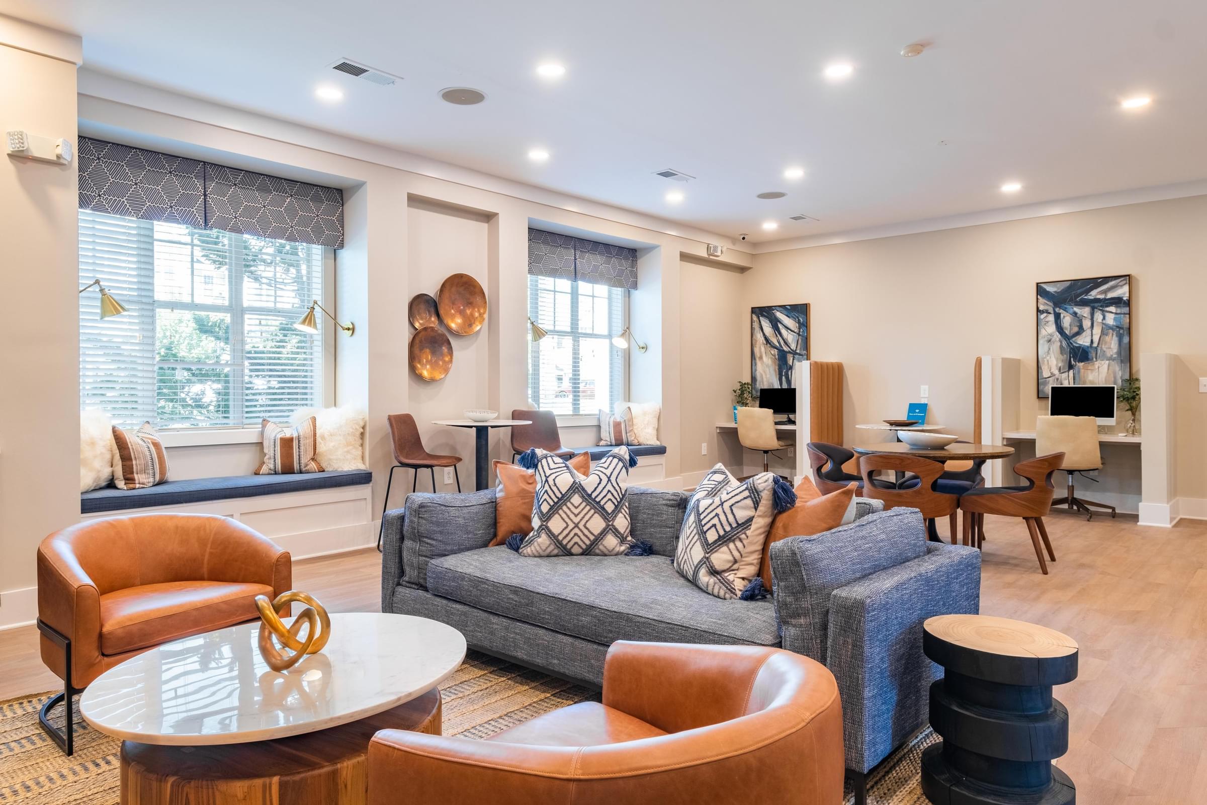 a living room filled with furniture and a large window