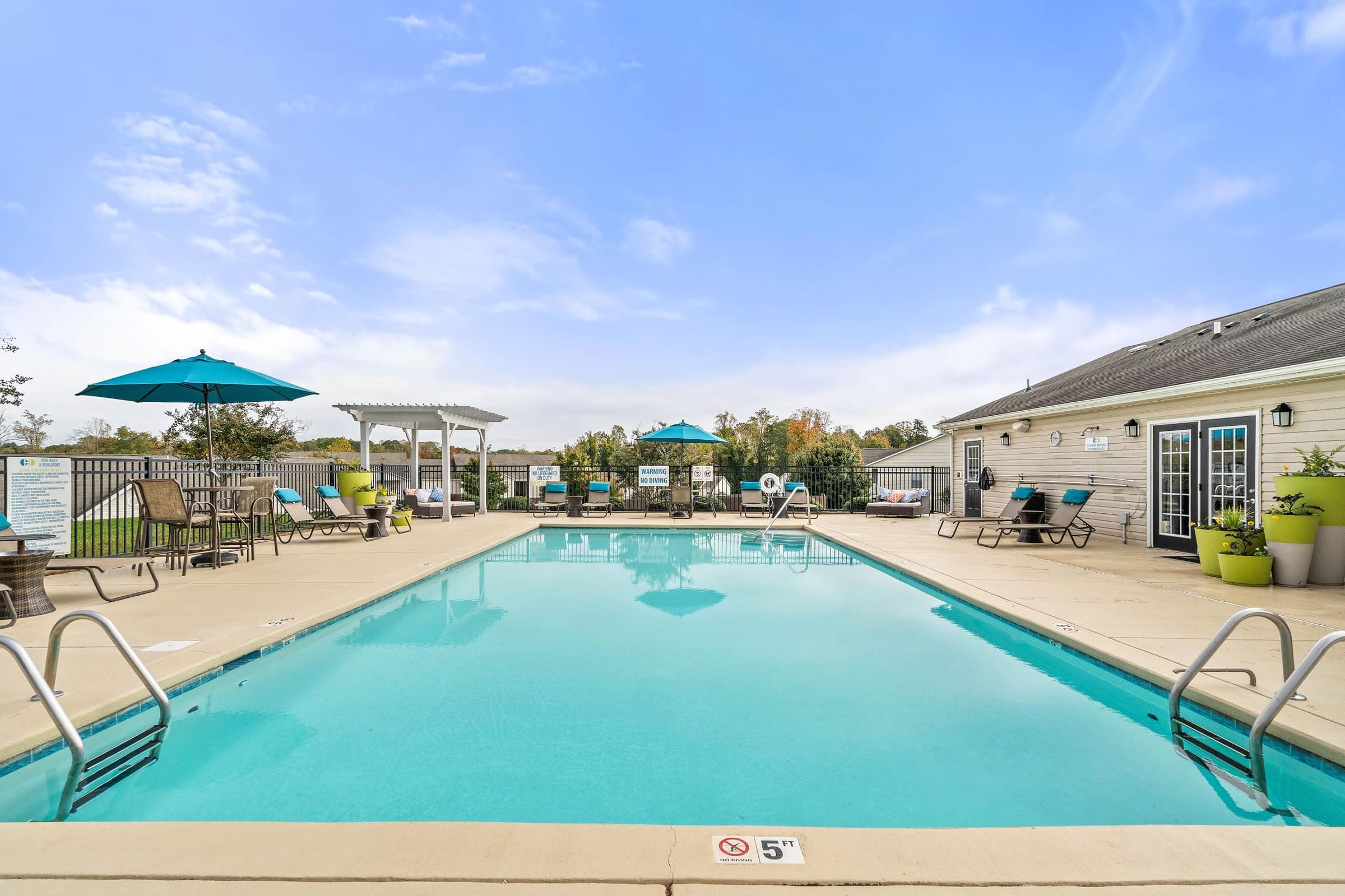 Resort-Style Swimming Pool with Expansive Sun Deck