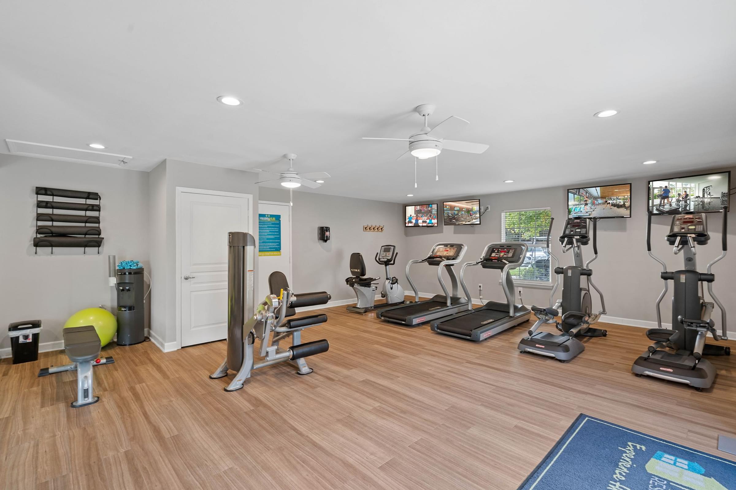 24-Hour Fitness Center with Cardio Equipment and Free Weights