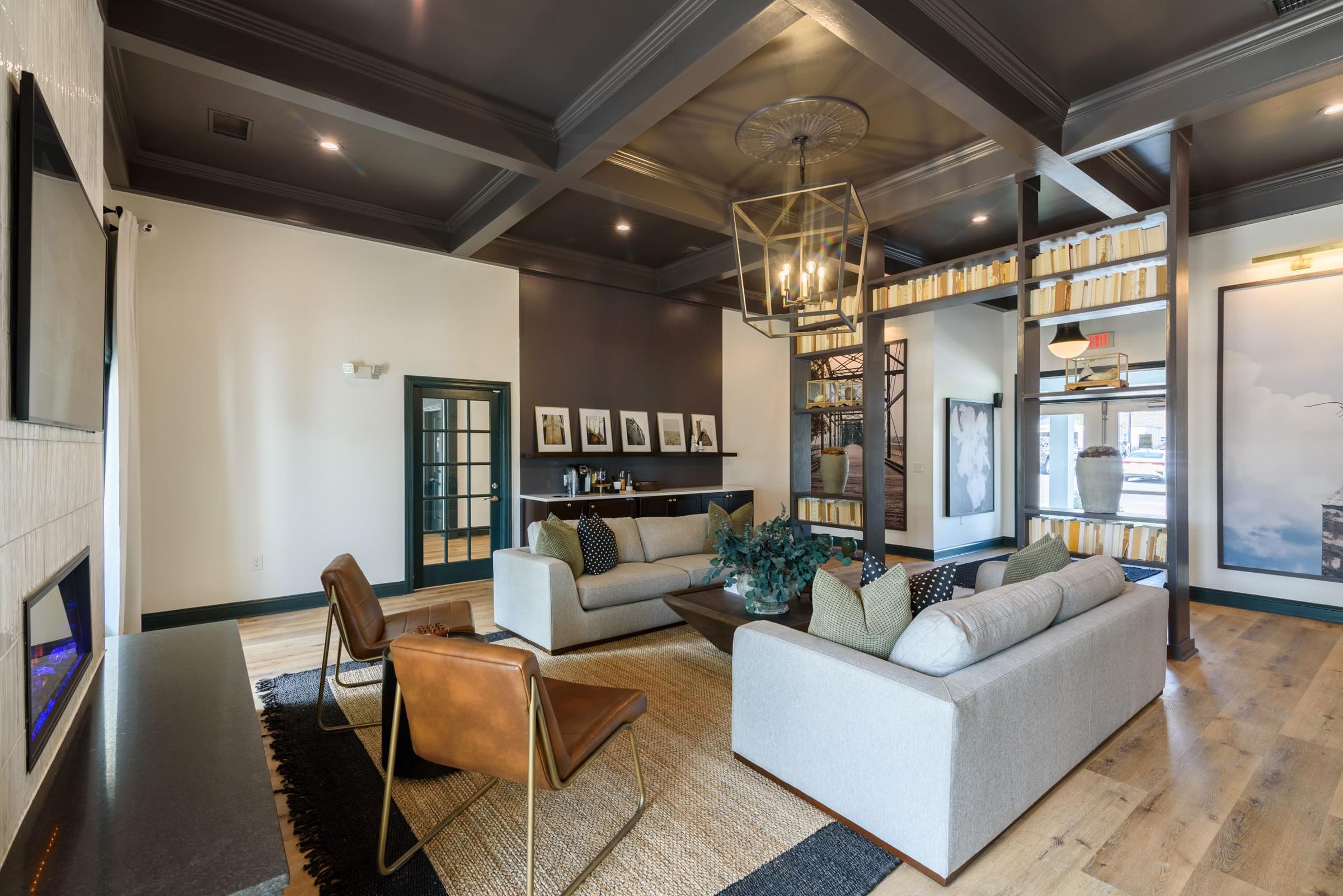 a living room with couches and chairs and a fireplace