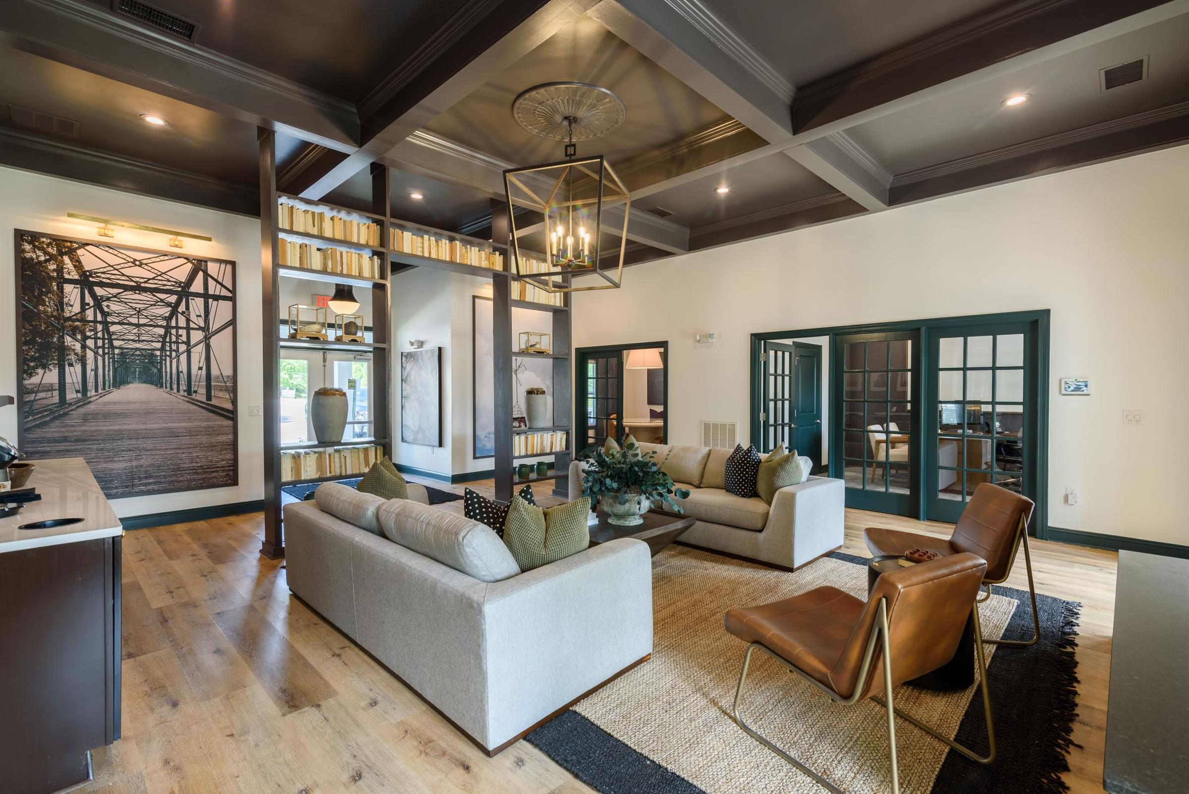 a large living room with couches and chairs