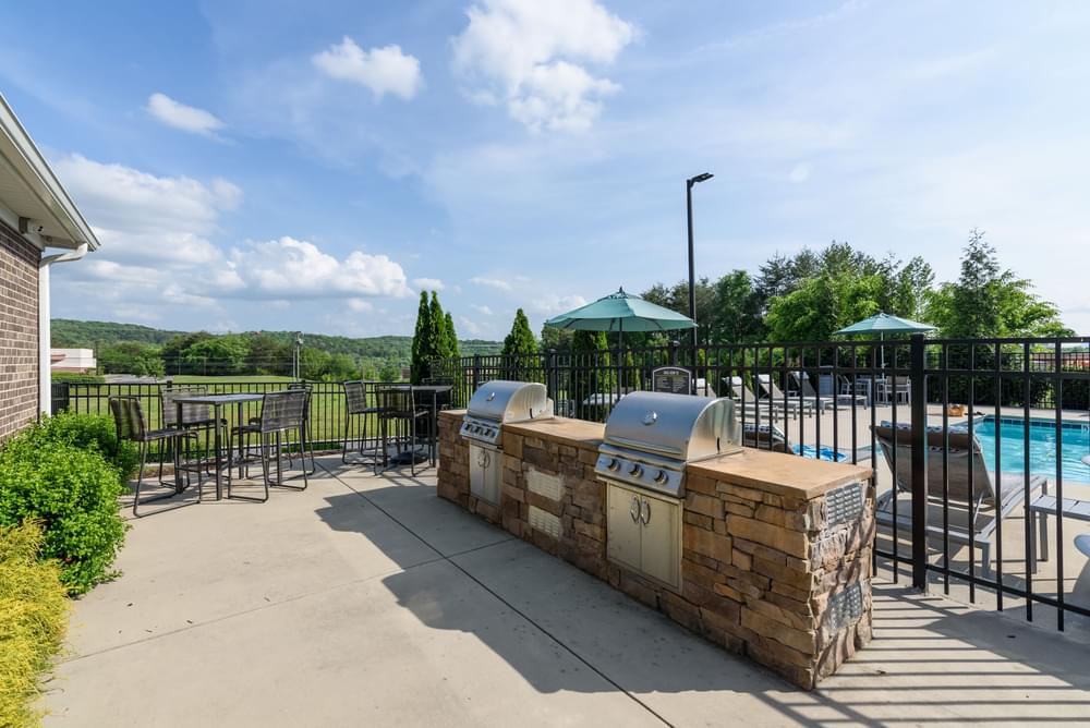 the estates at tanglewood  outdoor grilling area with pool