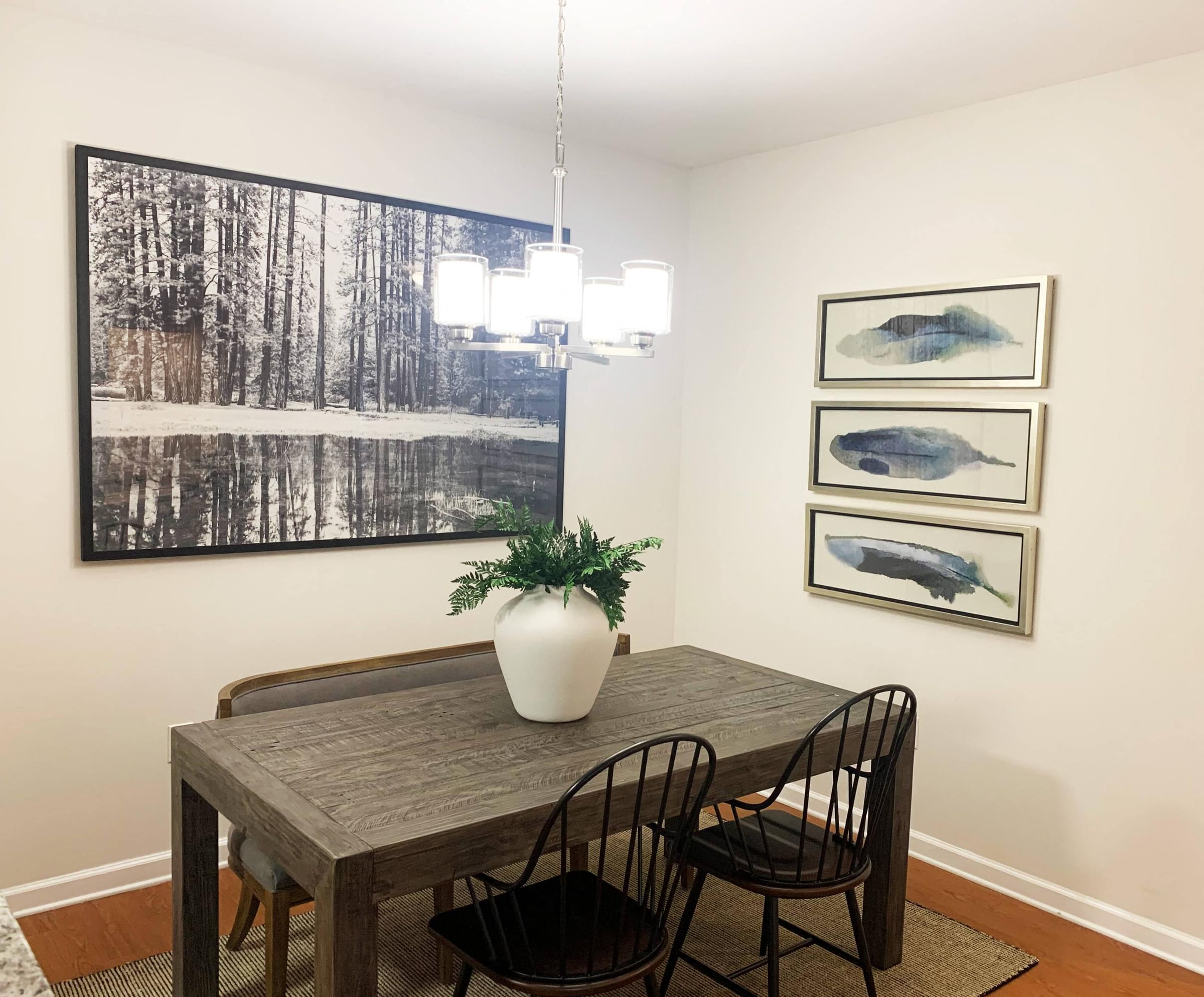 a dining room with a table and chairs