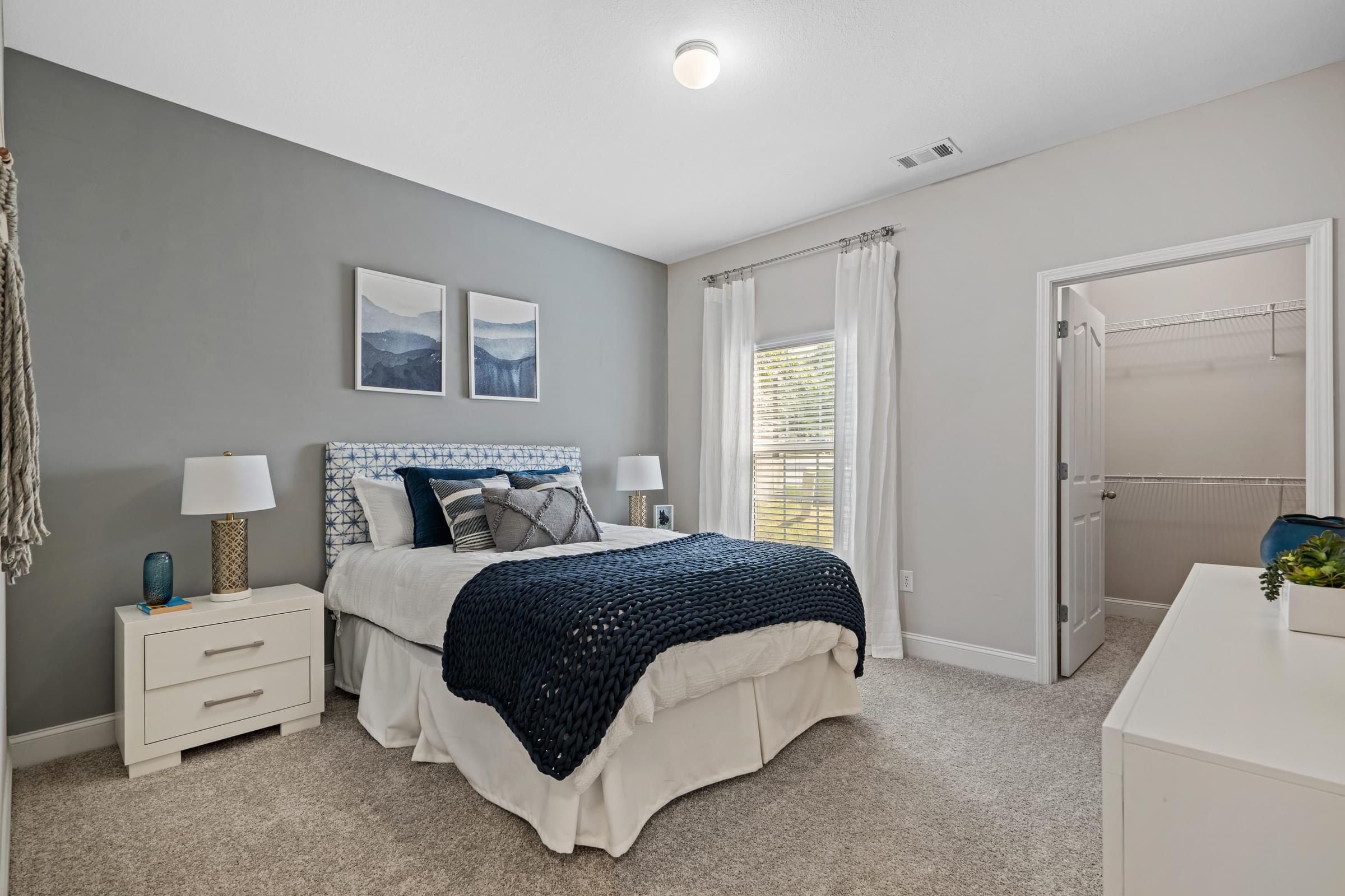 Spacious Walk-In Closets with Custom Shelving