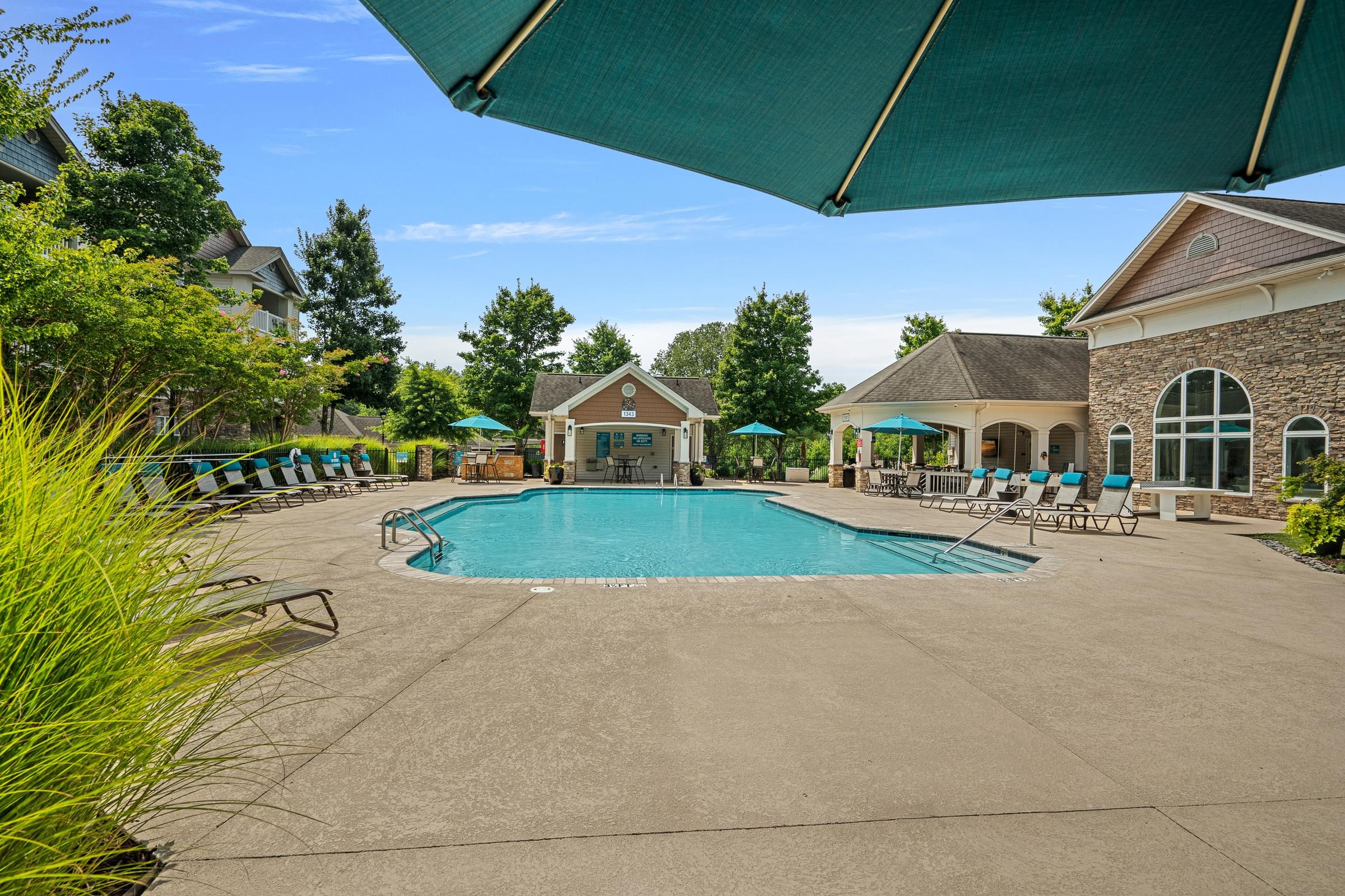 Resort-Style Swimming Pool with Expansive Sundeck, Poolside Grilling Stations, and Outdoor Table Tennis