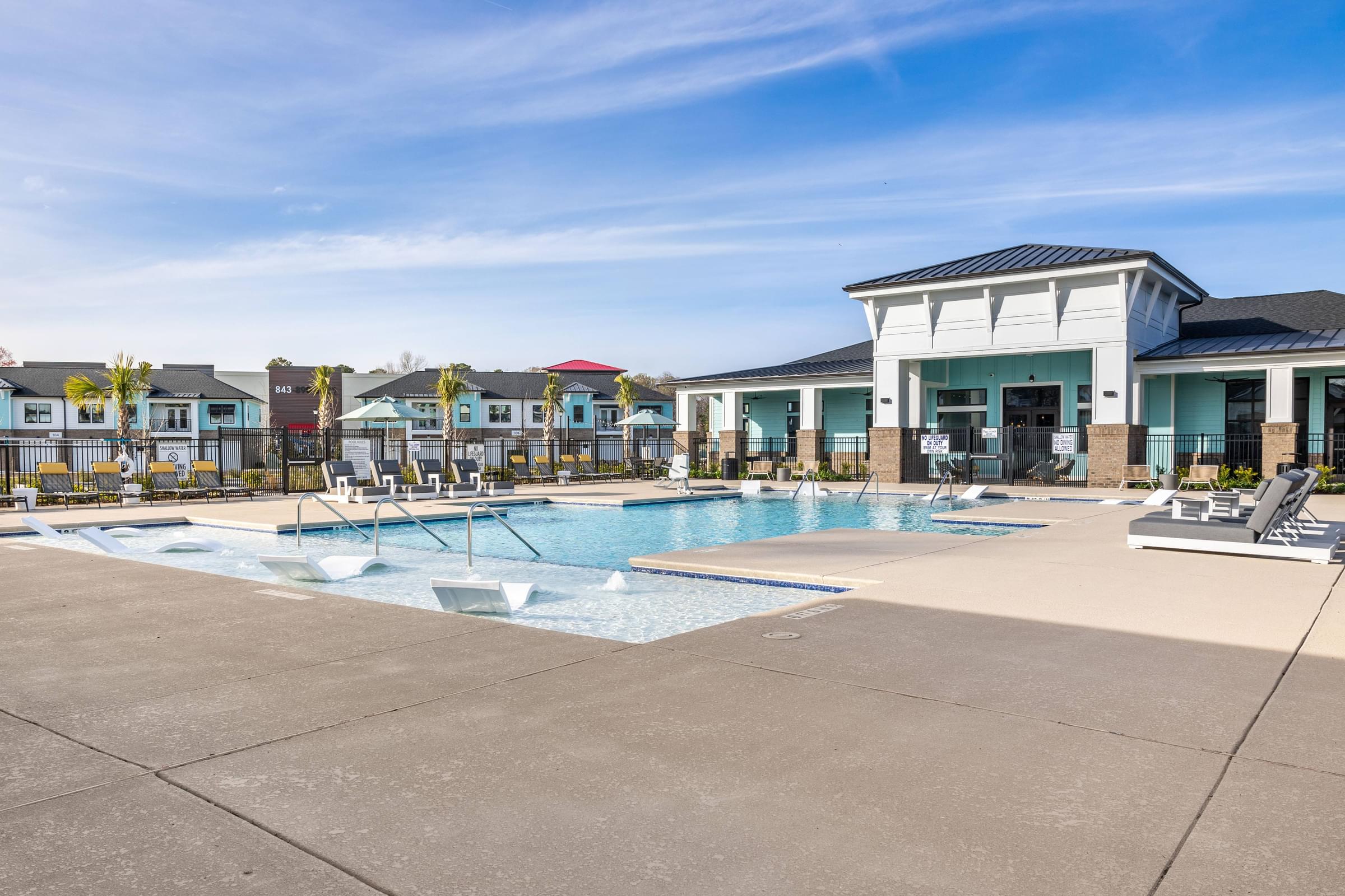the swimming pool at the estates apartments