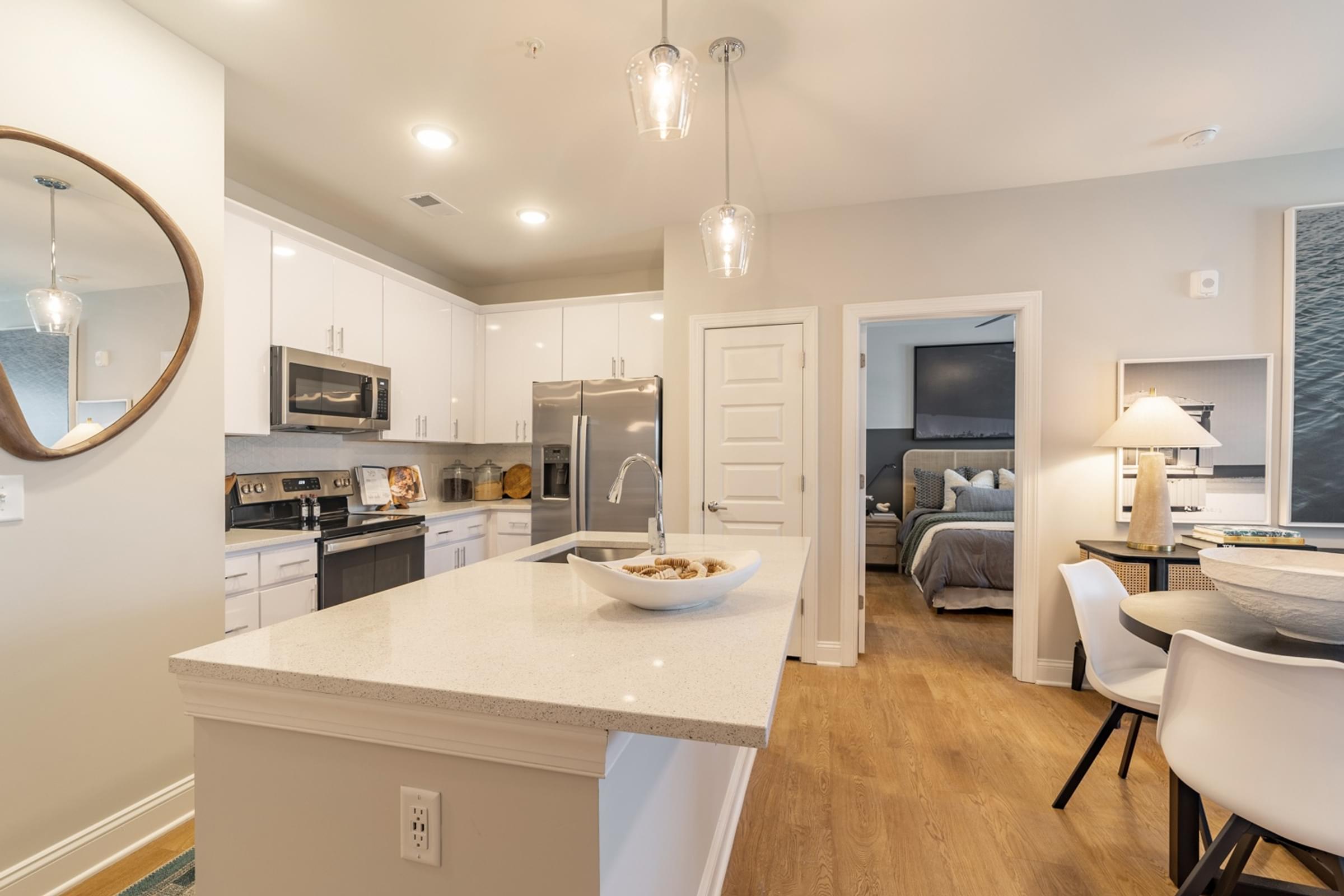 A modern kitchen with a breakfast bowl on the island.