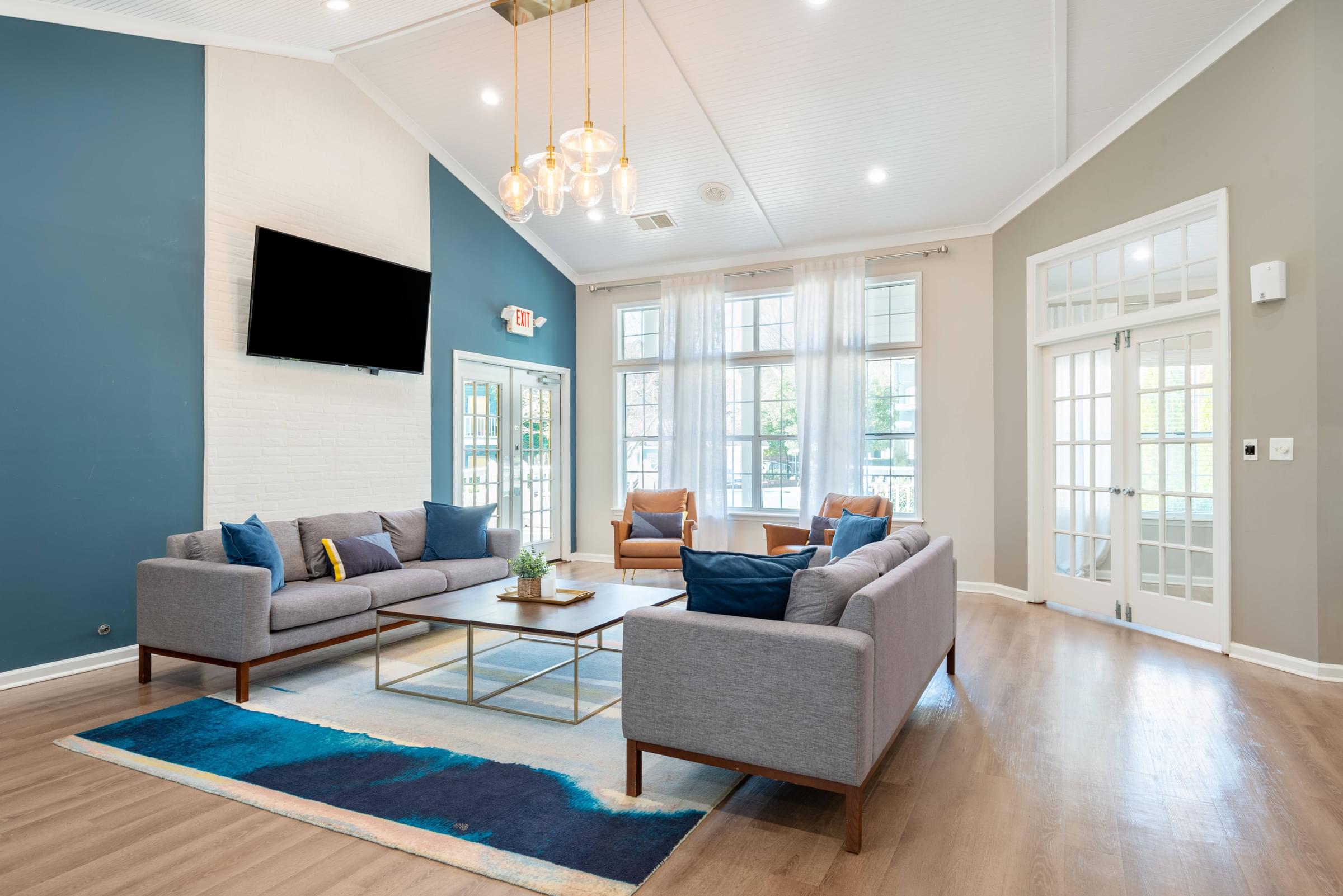 a living room with couches chairs and a coffee table