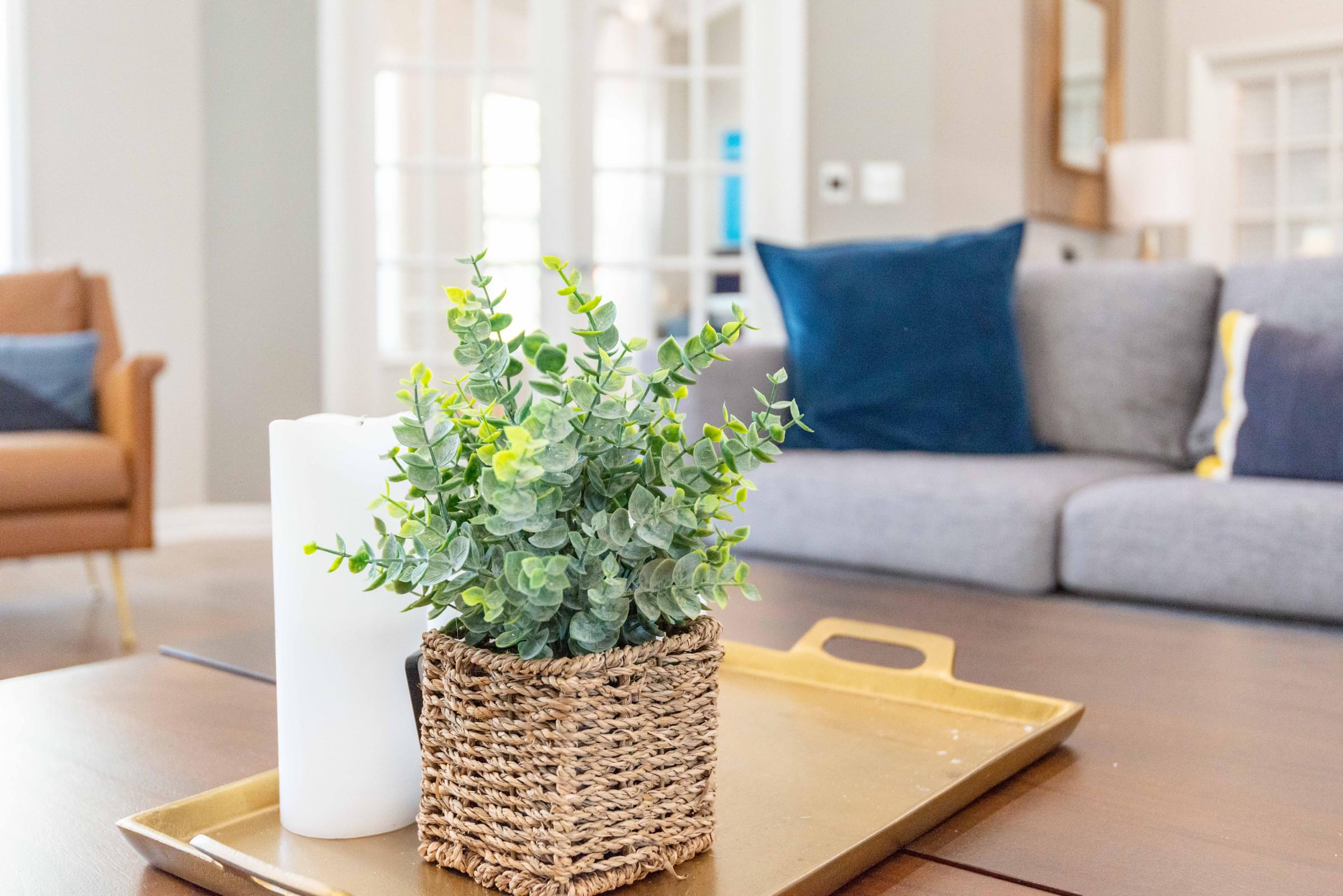 a living room filled with furniture and a large window