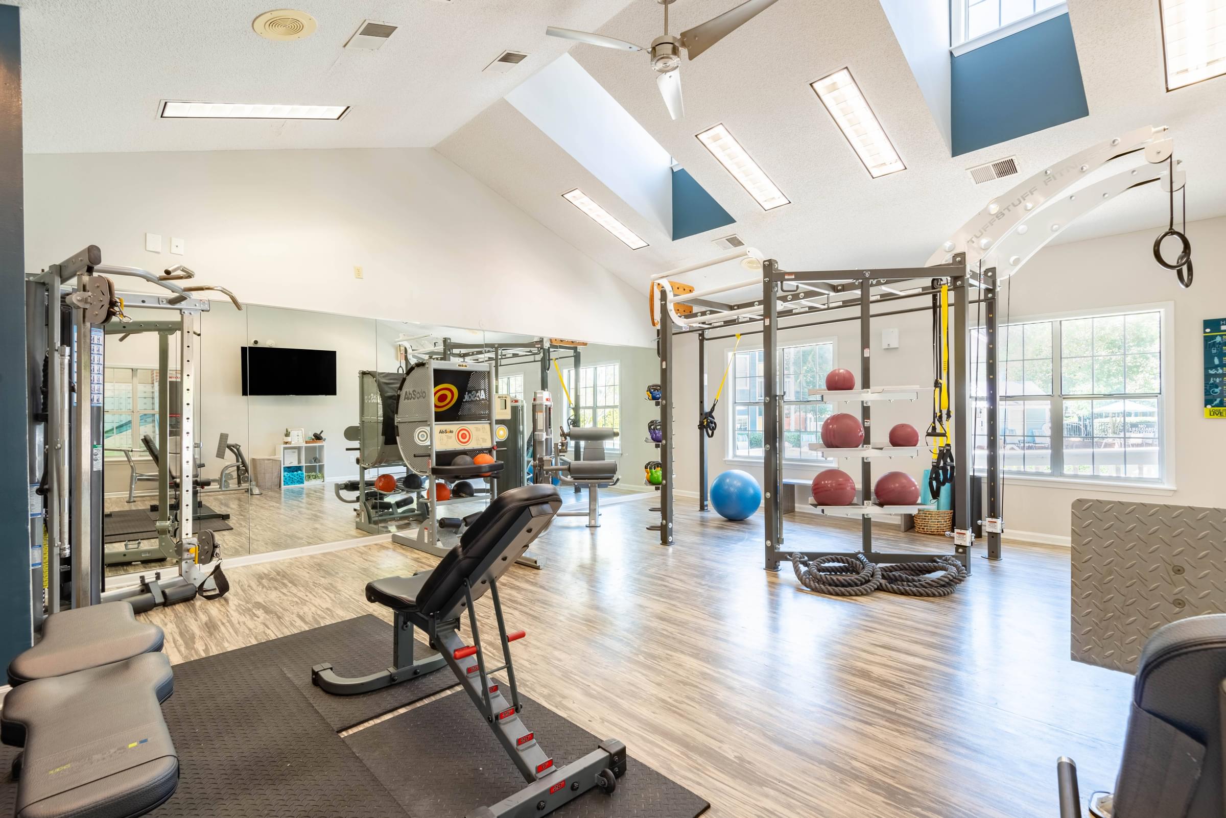 24-Hour Enhanced Fitness Center with Strength Training, Free Weights, and Cardio Equipment