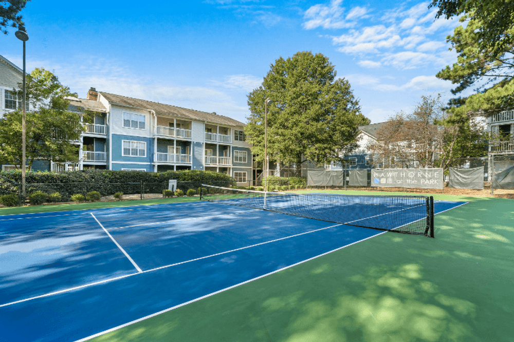 tennis court at the preserve at polo ridge apartments fl