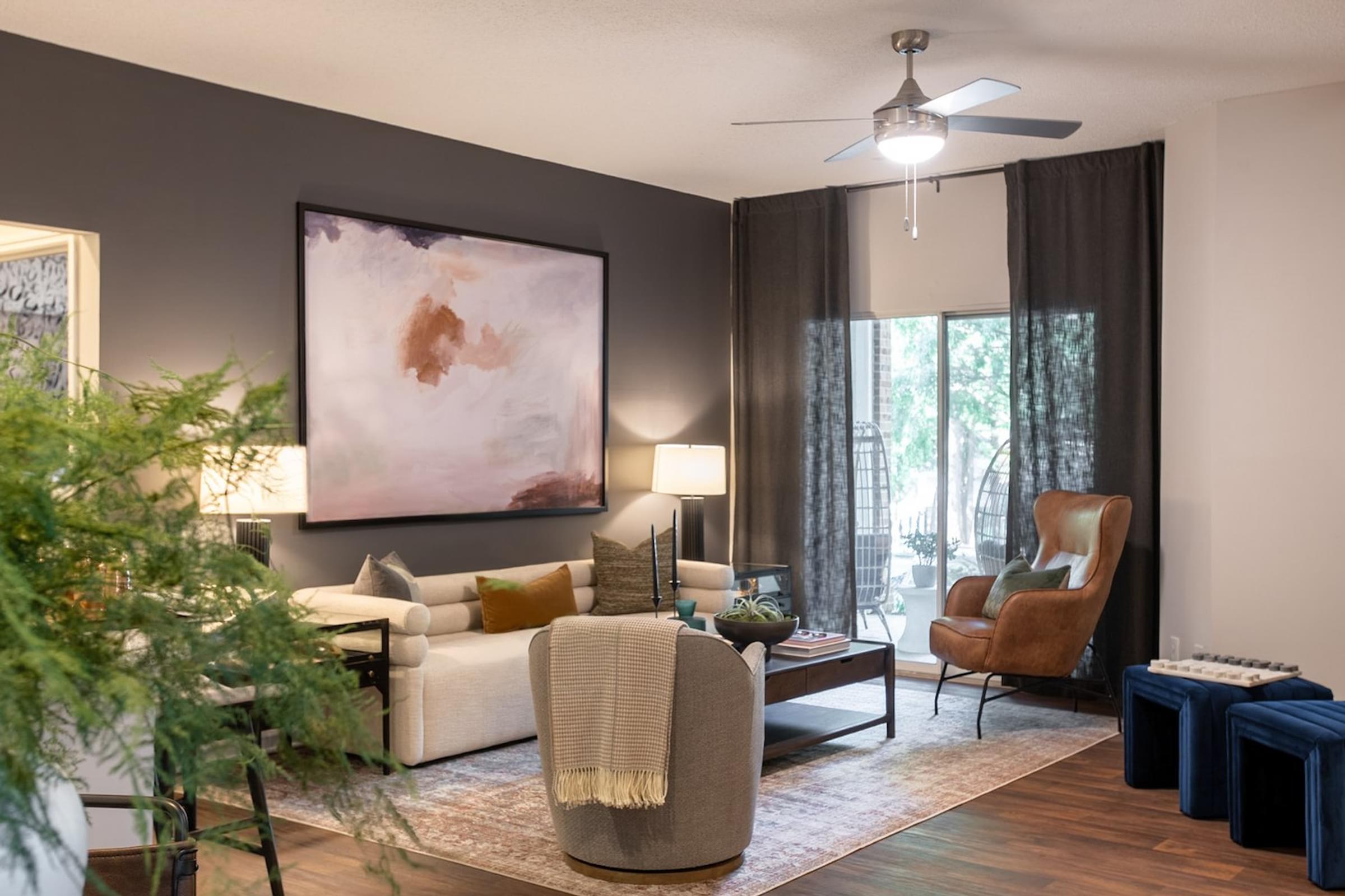 Spacious Living Room with Wood-Style Vinyl Flooring and Private Patio