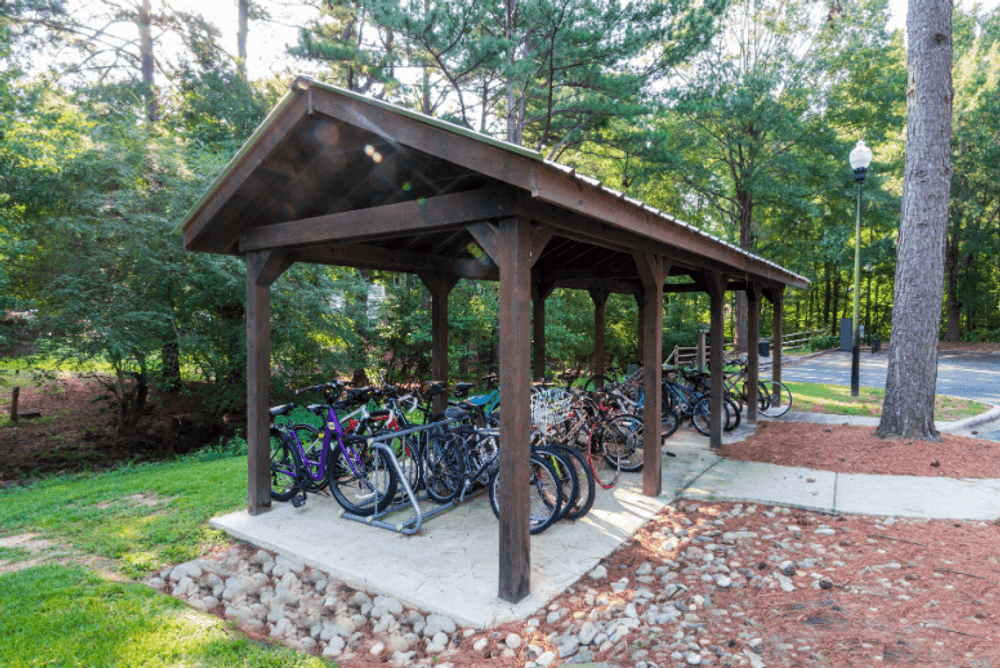 a shelter with bicycles parked under it