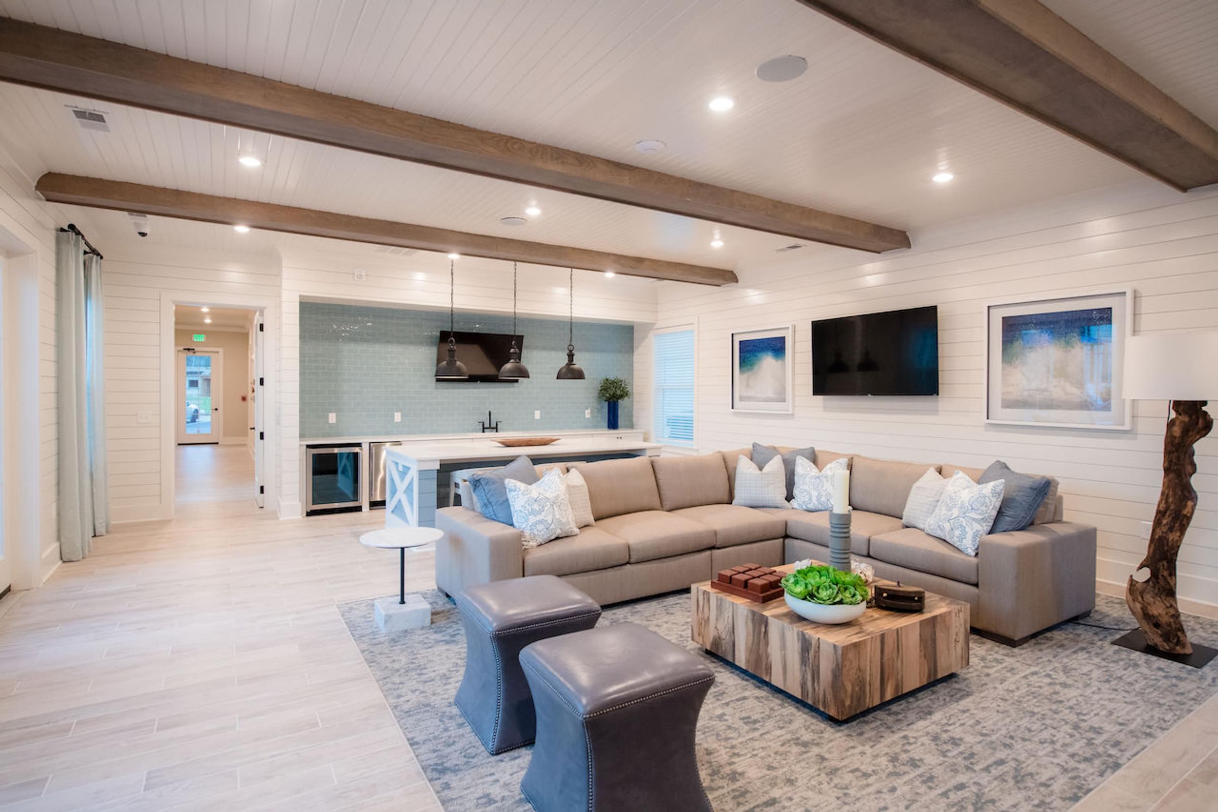 a living room filled with furniture and a large window