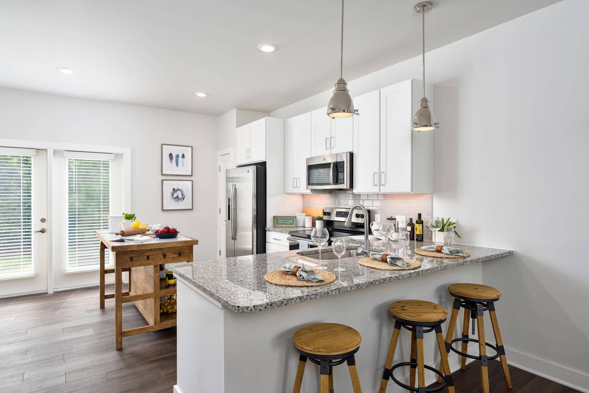 Custom Designed Kitchen with Stainless Steel Appliances and Granite Countertops
