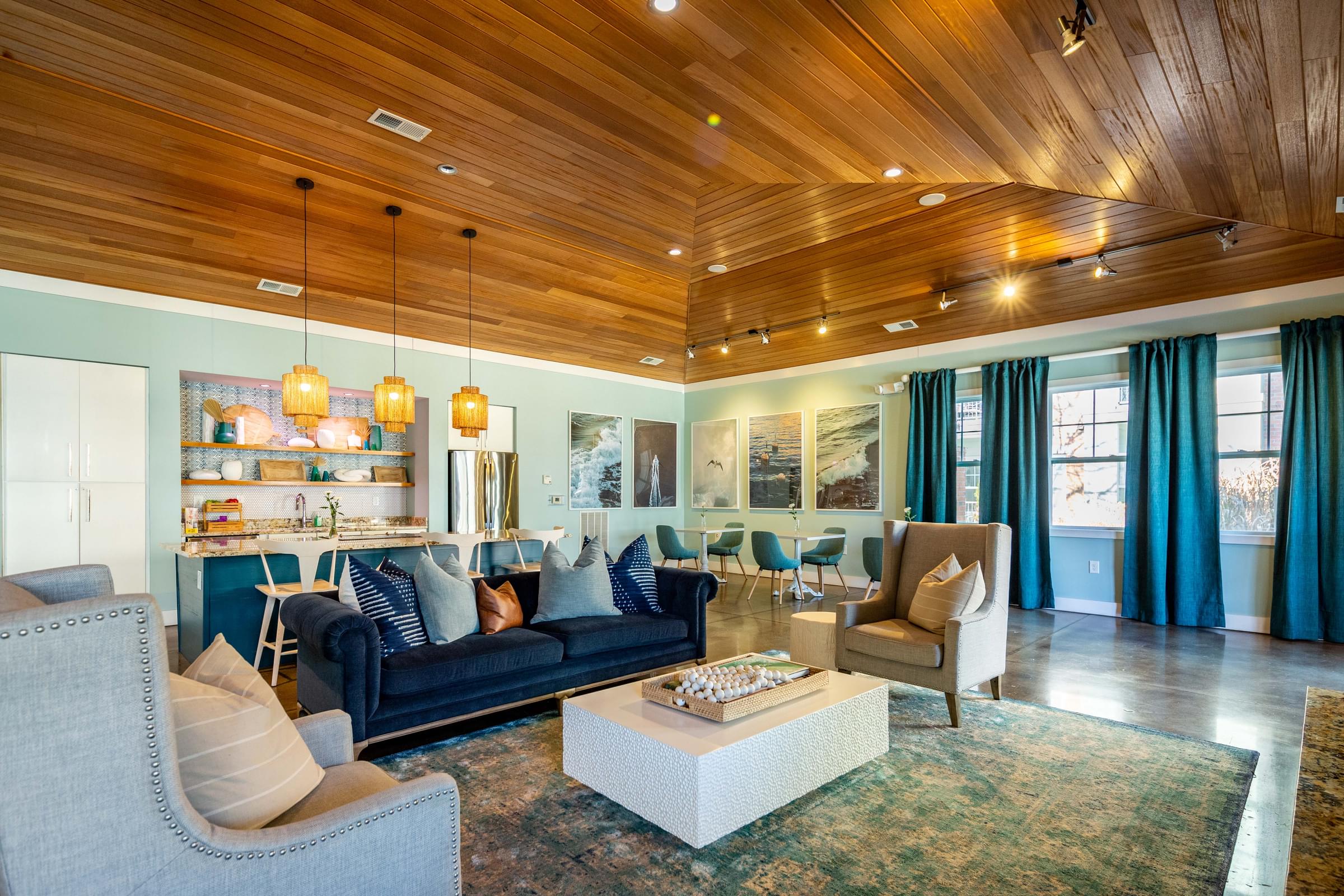 A living room with a blue couch and a coffee table