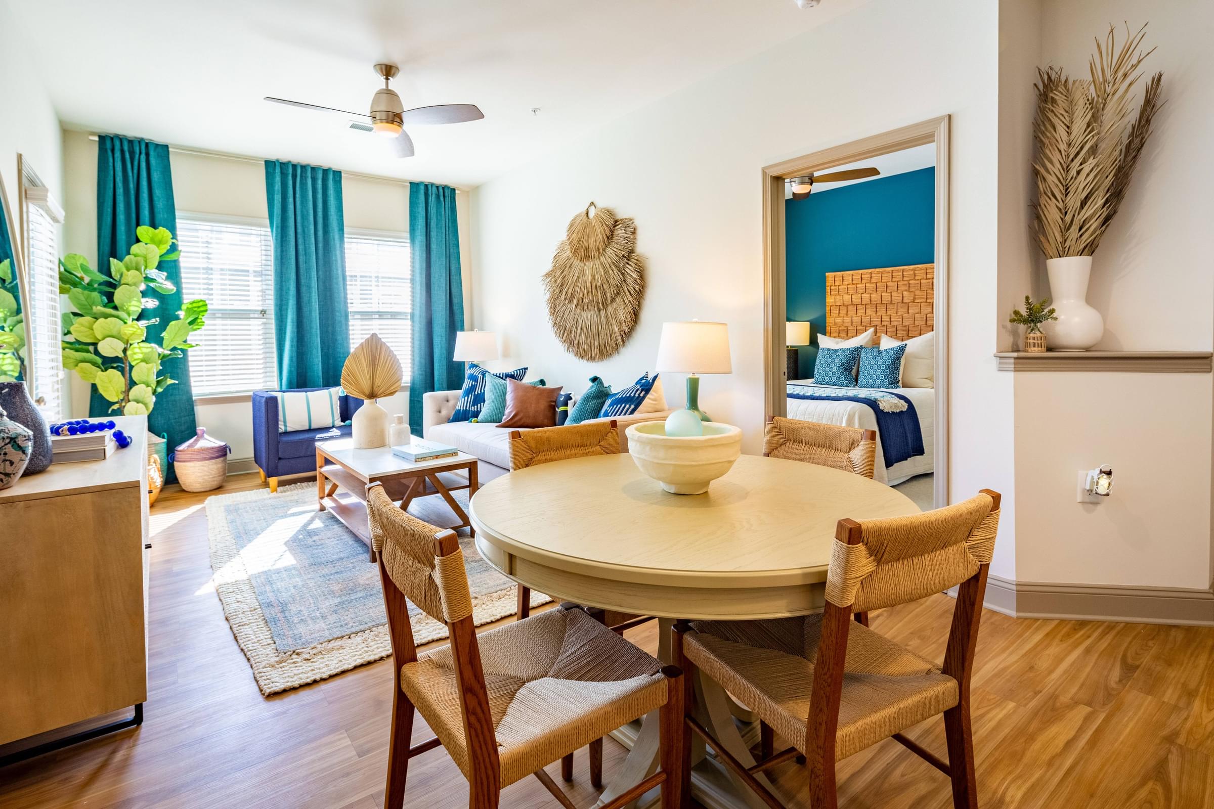 Dining Room and Living Room with Plank Wood Flooring and Ceiling Fan