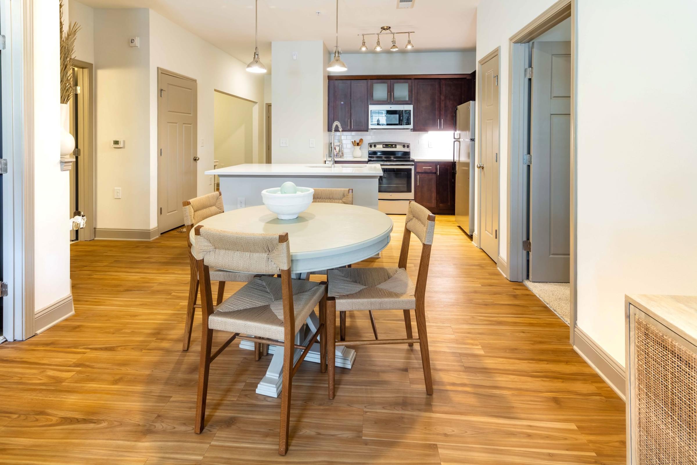 A modern dining room with a table and chairs