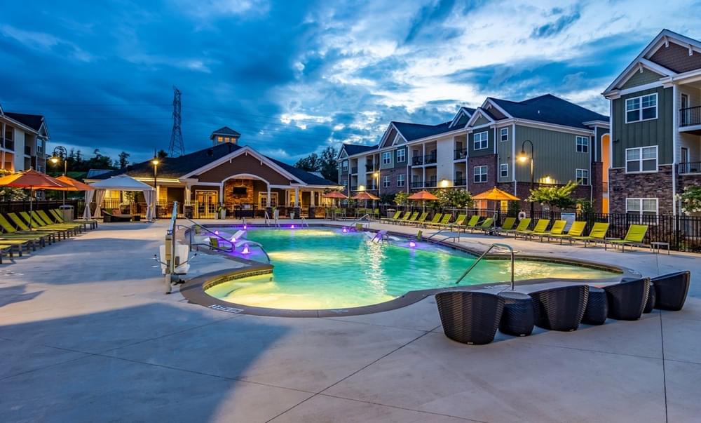 our apartments have a resort style pool and spa at dusk