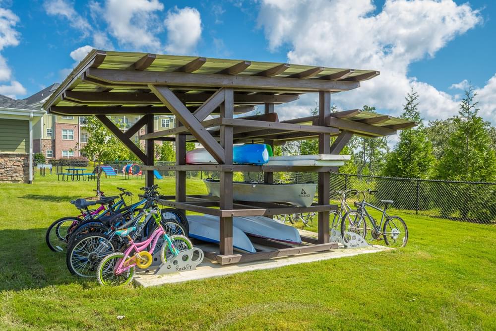 a group of bikes parked under a picnic shelter