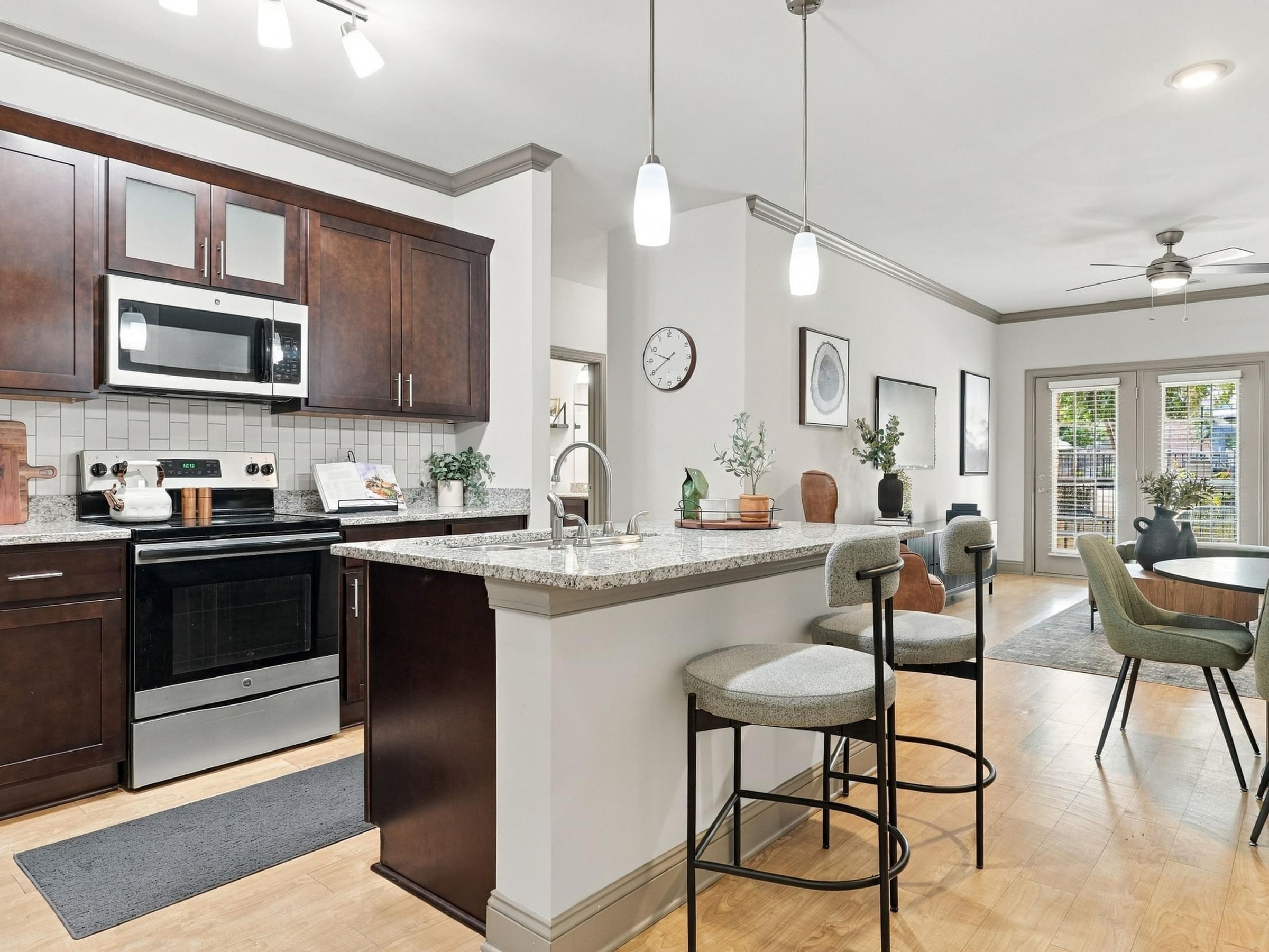 A kitchen with a bar area and a dining table.