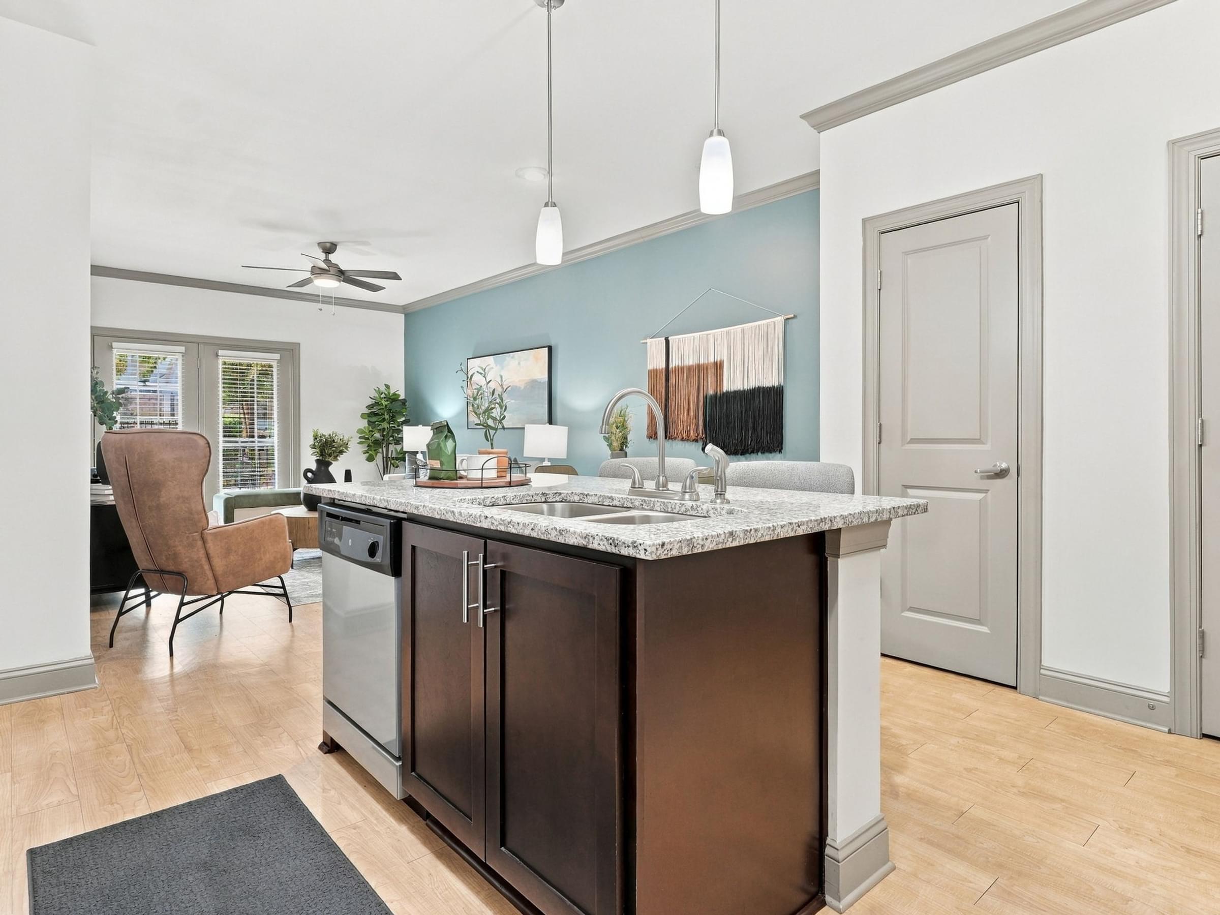 A kitchen with a brown island and a chair.
