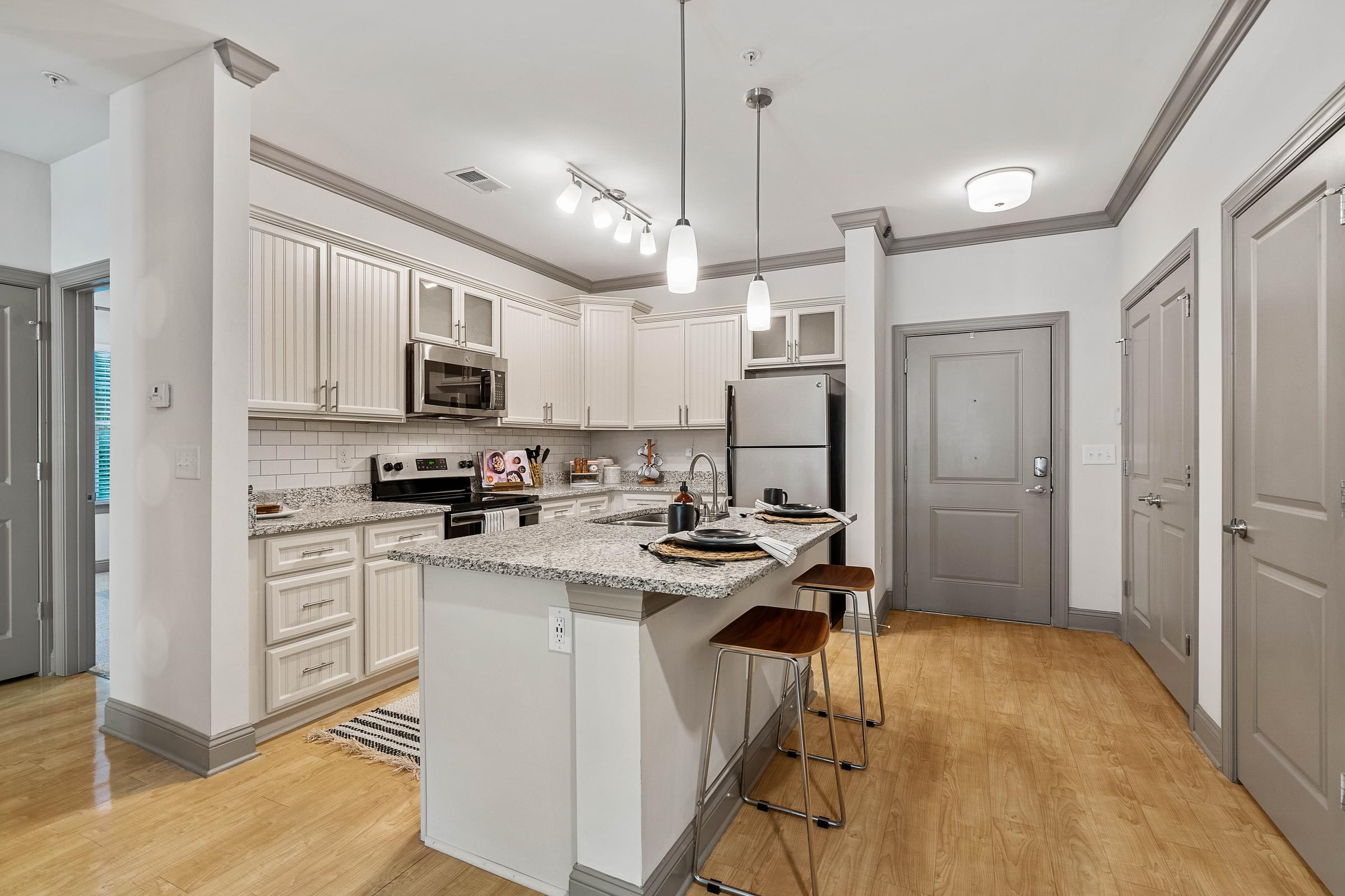 Modern Custom Kitchen With Granite Countertops and Stainless Steel Appliances